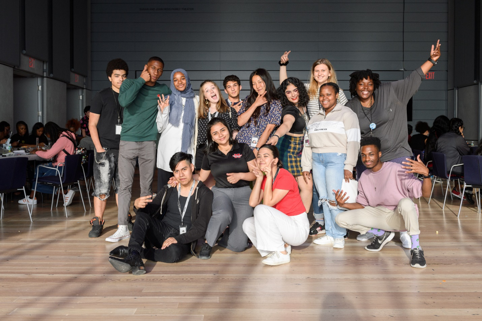 A photograph of people smiling at the camera.