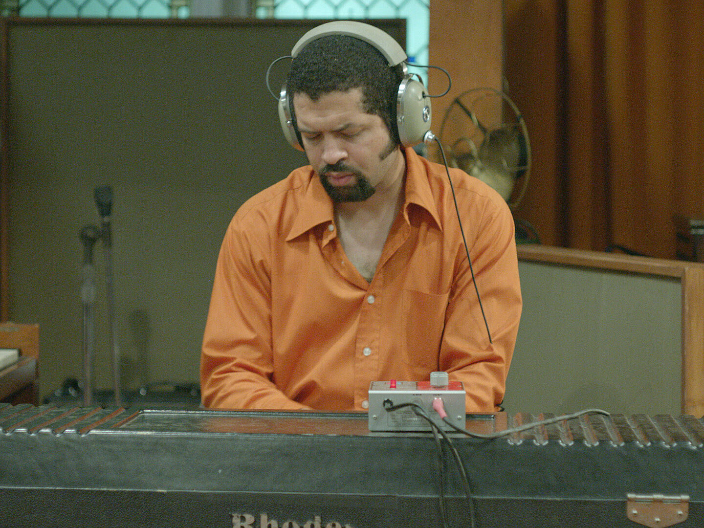 A person listening in a recording studio.