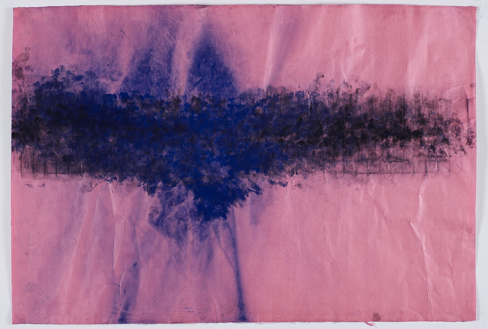 A sheet of pink paper with blue ink.