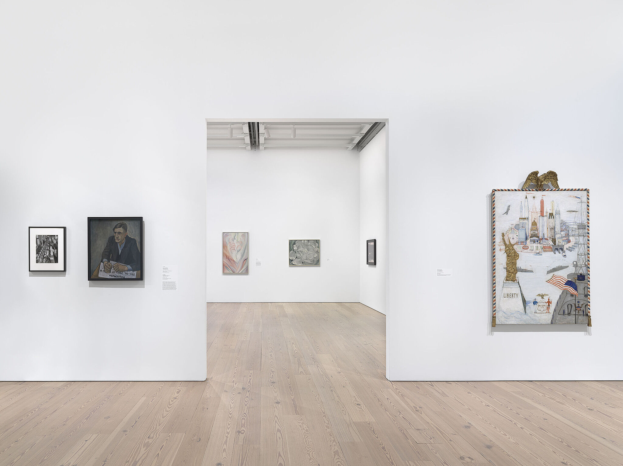 An image of the Whitney galleries with paintings on the wall