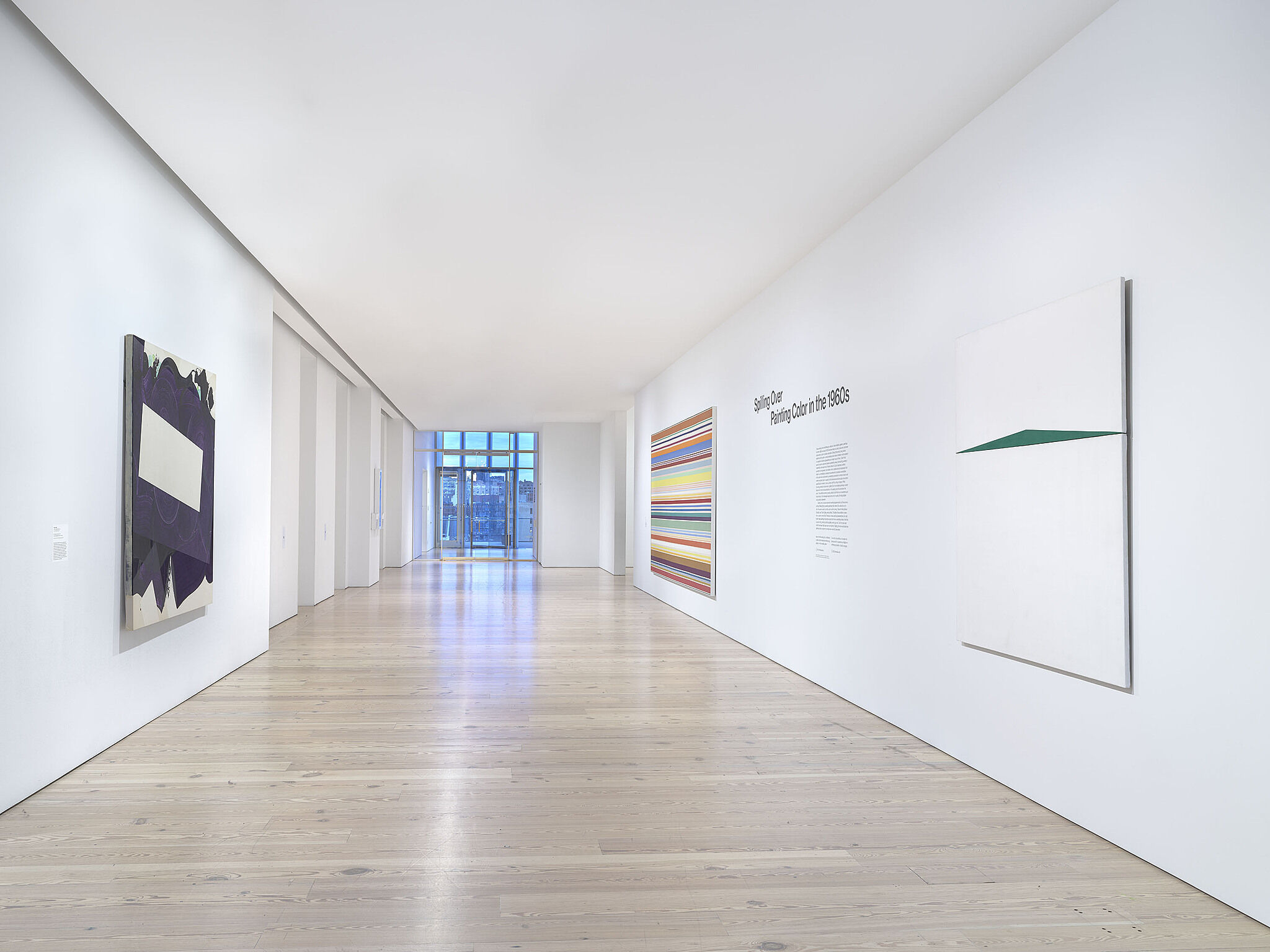 An image of the Whitney galleries with paintings on the wall