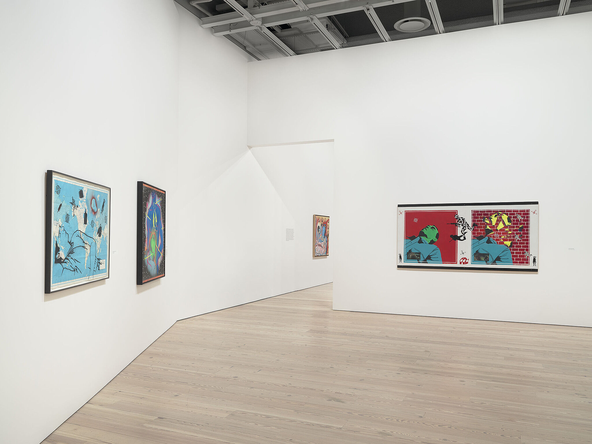 An image of the Whitney galleries with various artworks on the wall