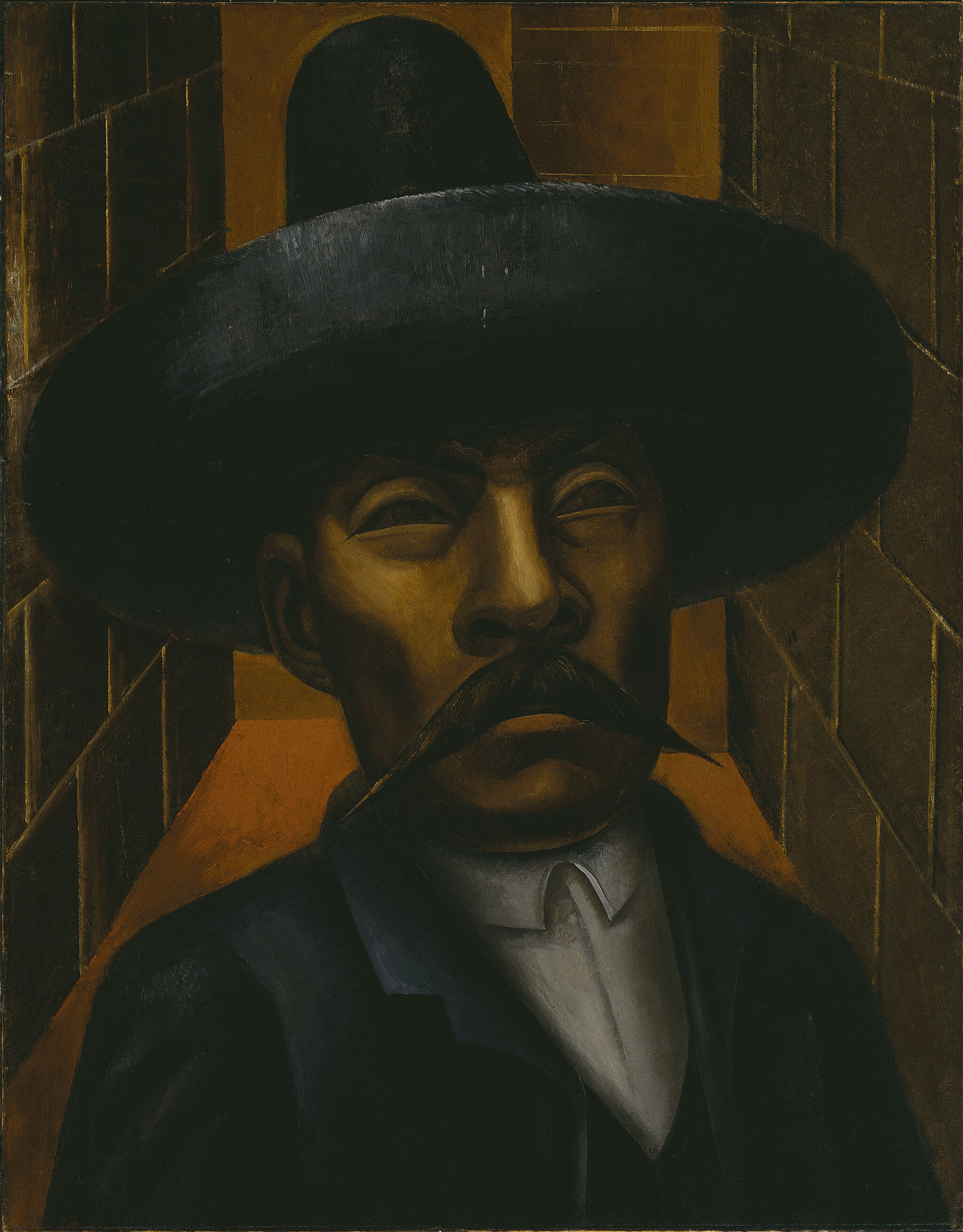 A man wearing a wide black hat and a prominent mustache against a geometric background.