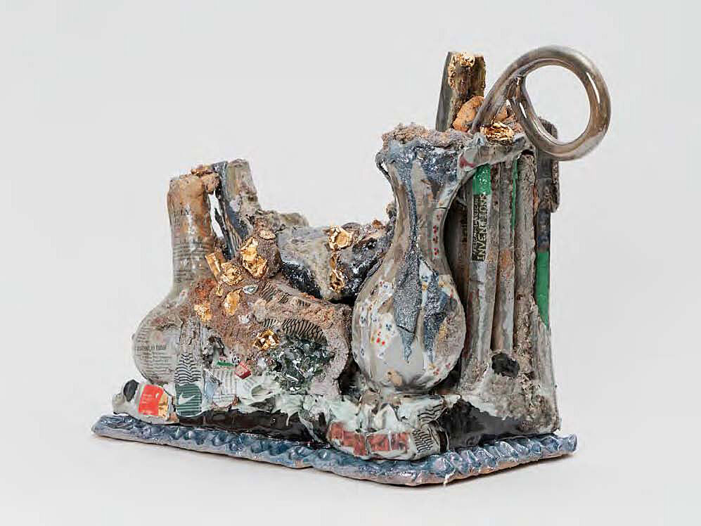 An amorphous ceramic blue and silver sculpture.