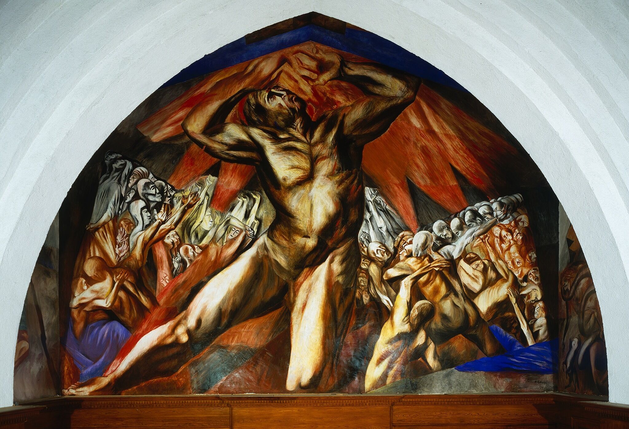 A photo of a mural depicting a tortured-looking man.