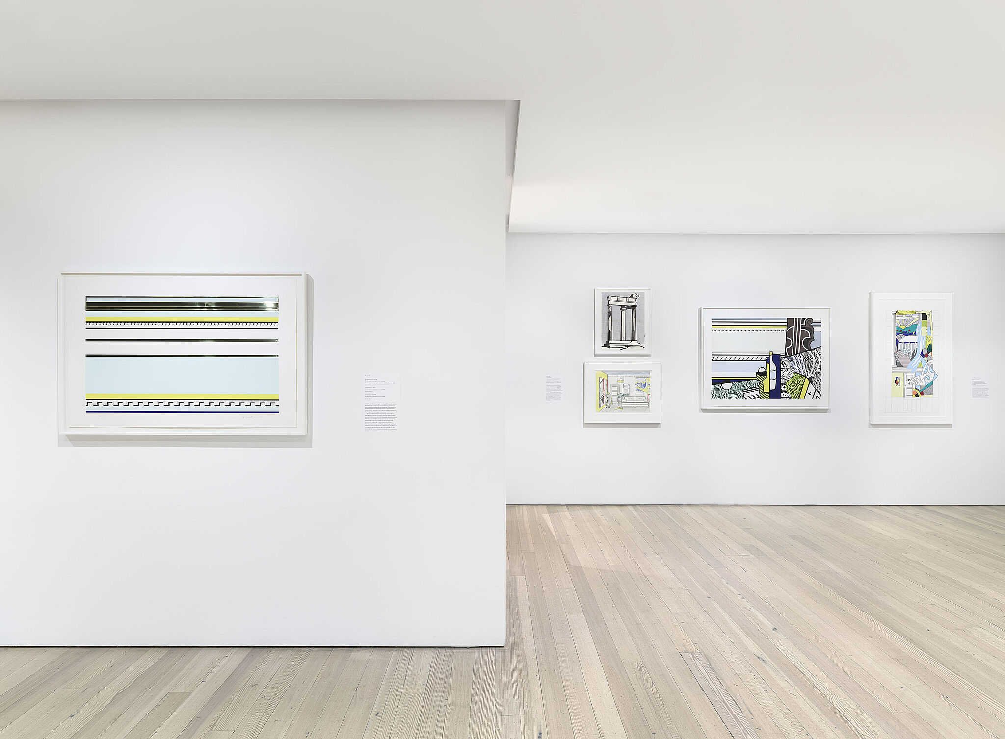 A photo of a Whitney gallery with various artworks on the wall.