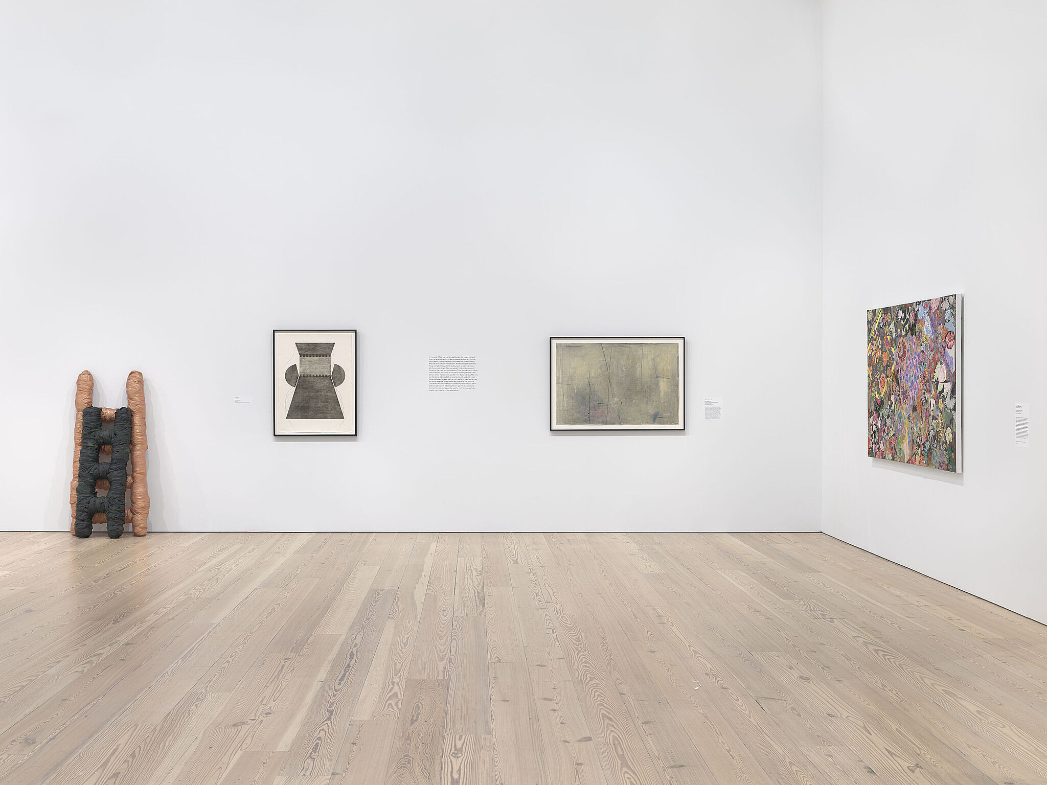 A photo of a Whitney gallery with various artworks.