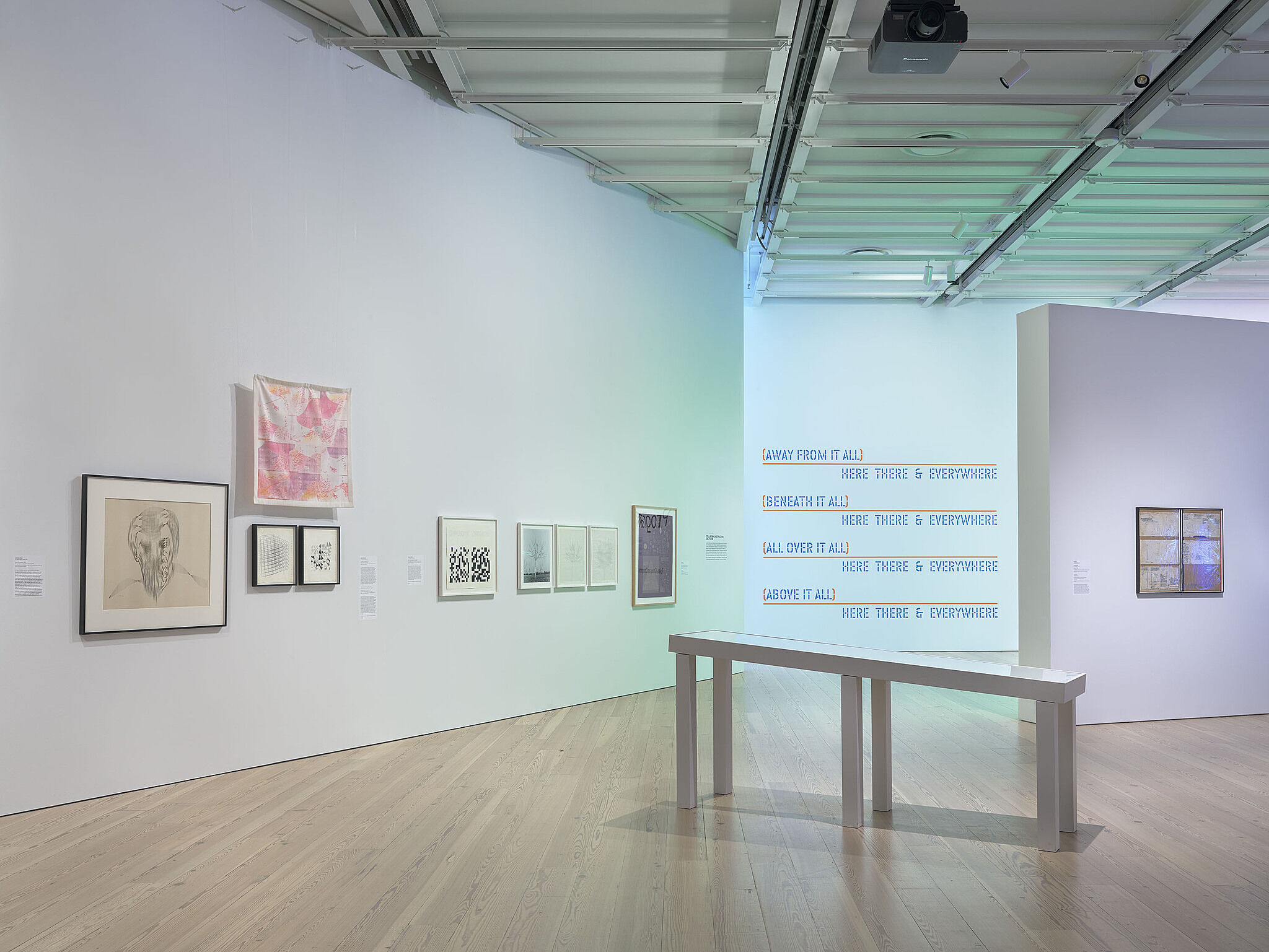 A photo of the Whitney galleries with various artworks.