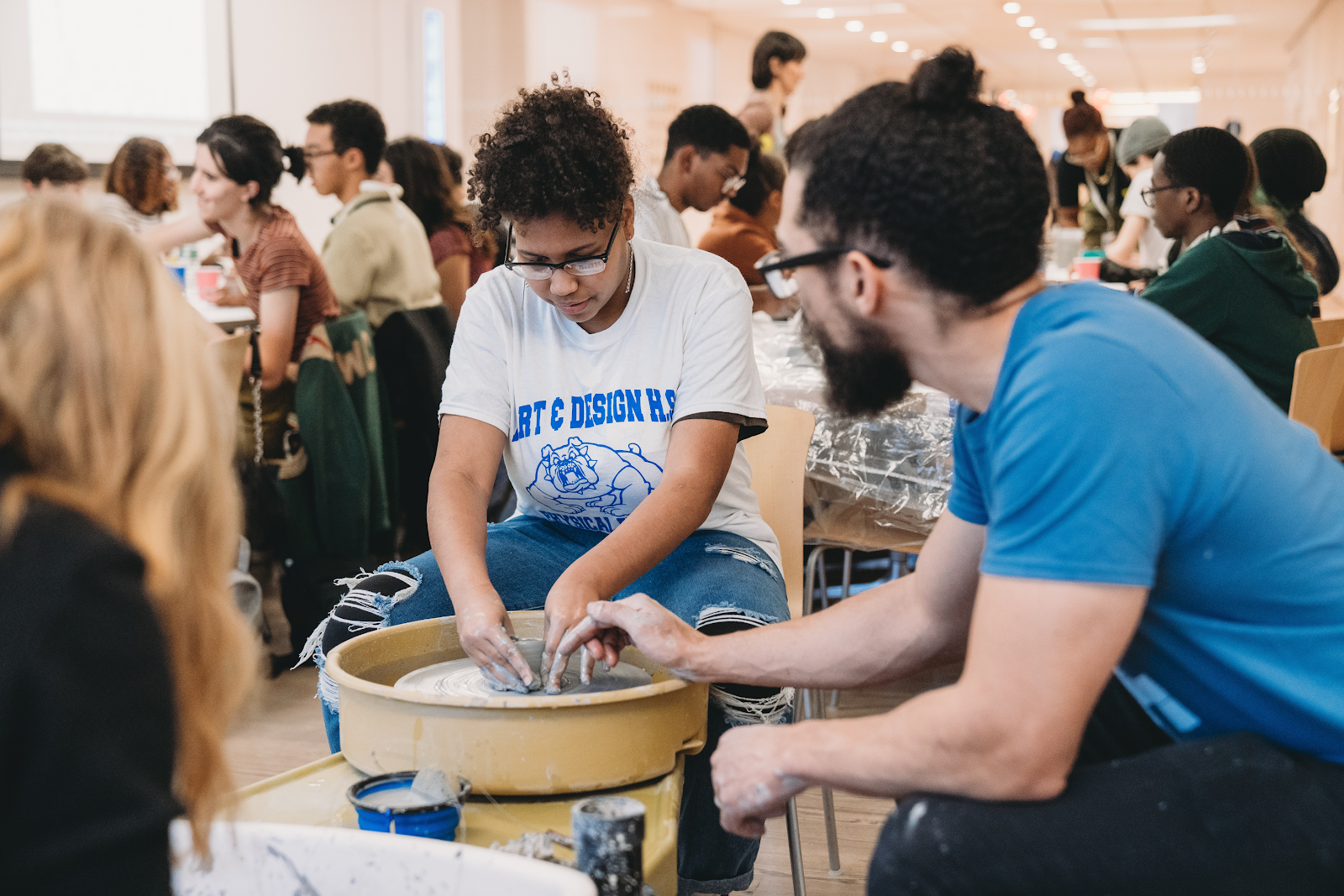 Teens learning new techniques from hand building clay sculptures to experimenting on the potter’s wheel with Greenwich House Pottery