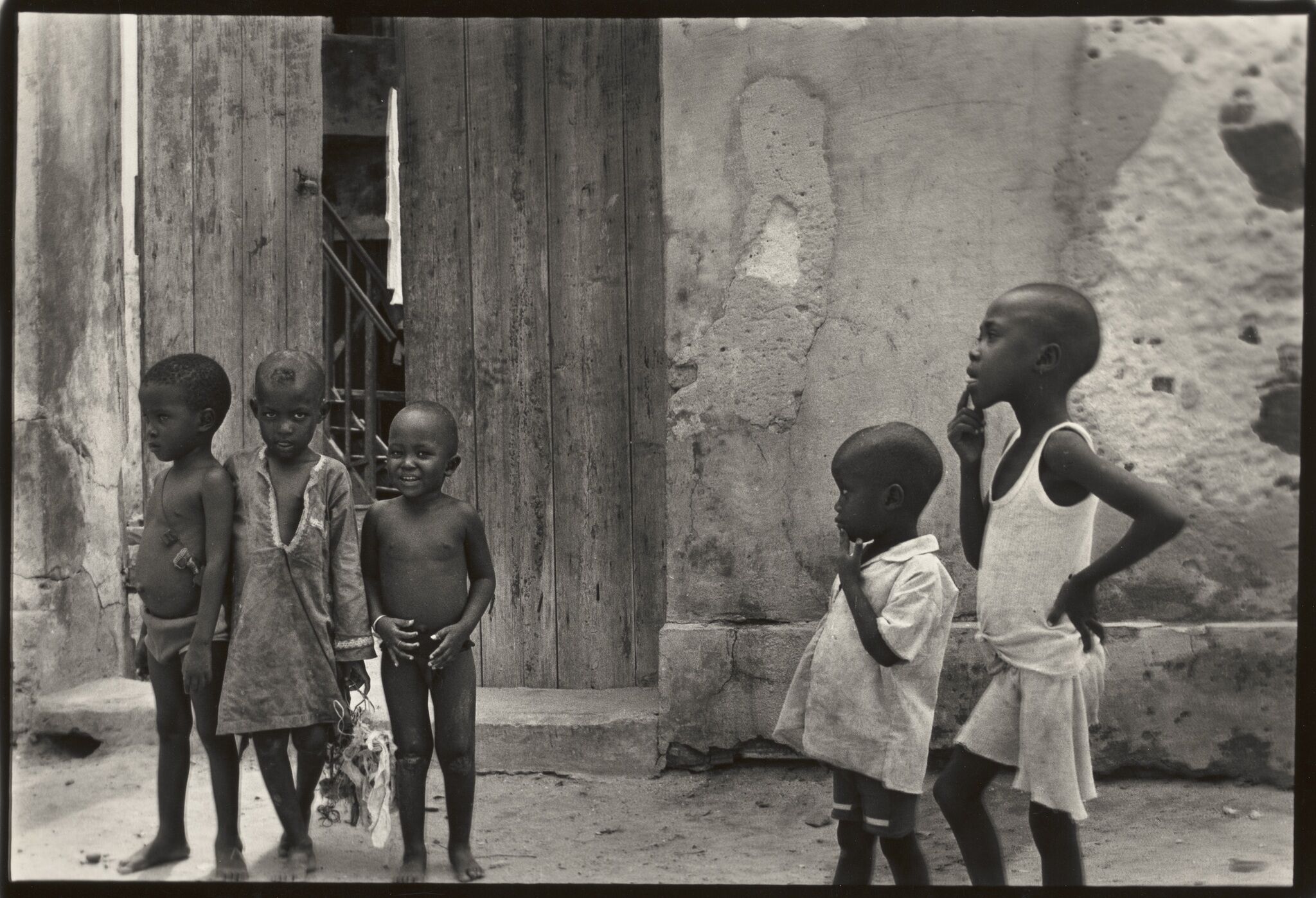 Children standing on a street.