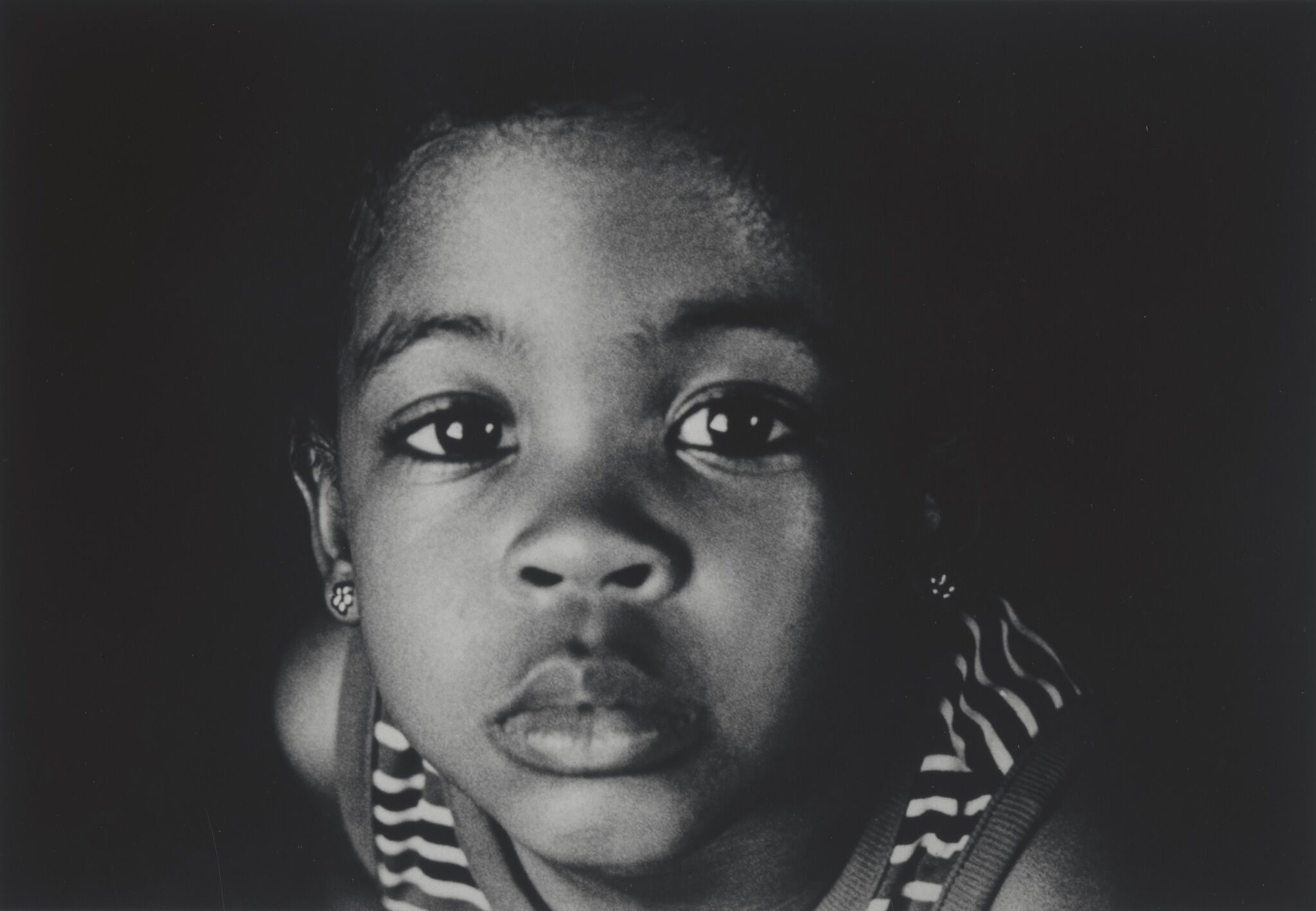 A close up portrait of a child's face.
