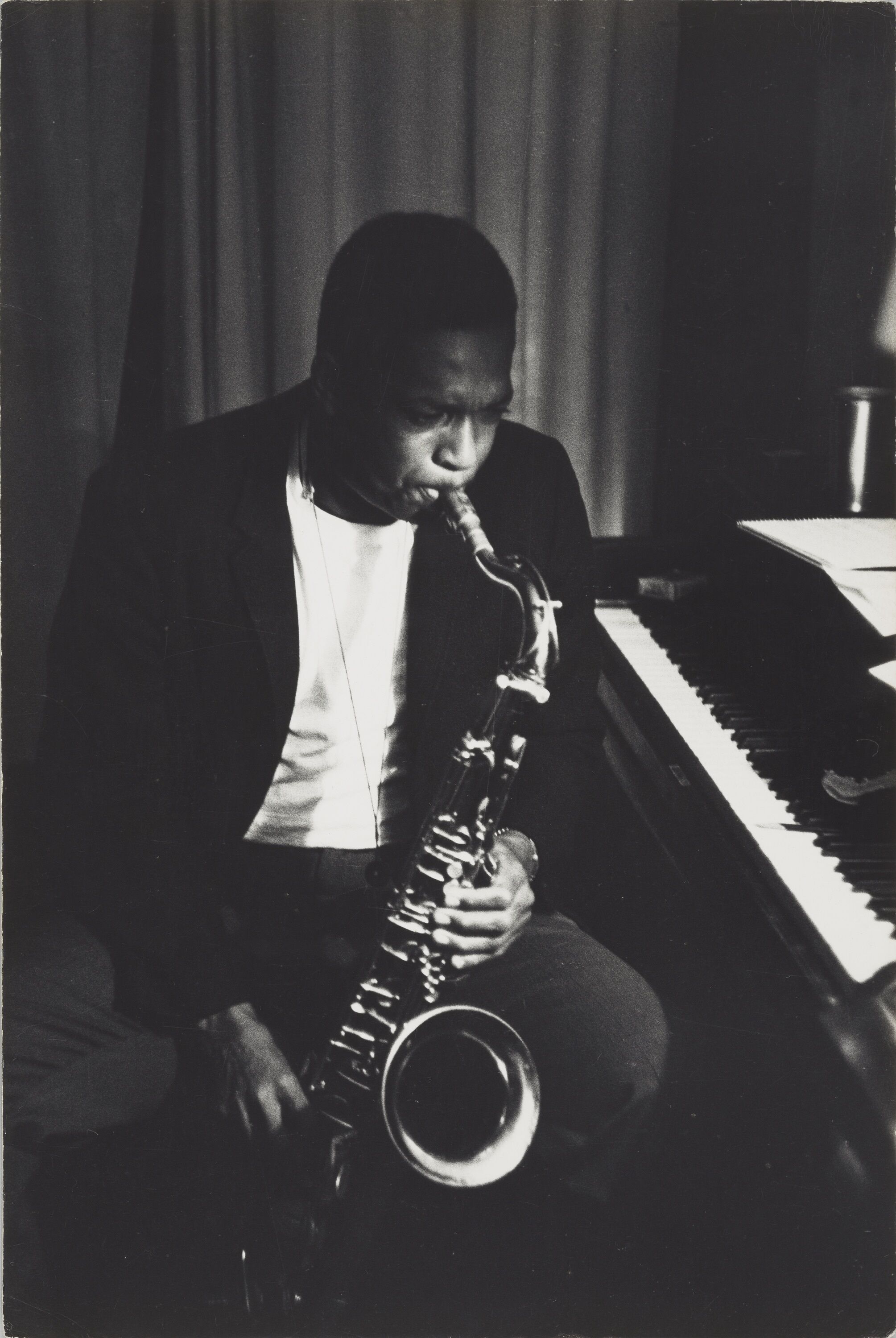 John Coltrane playing a saxophone.