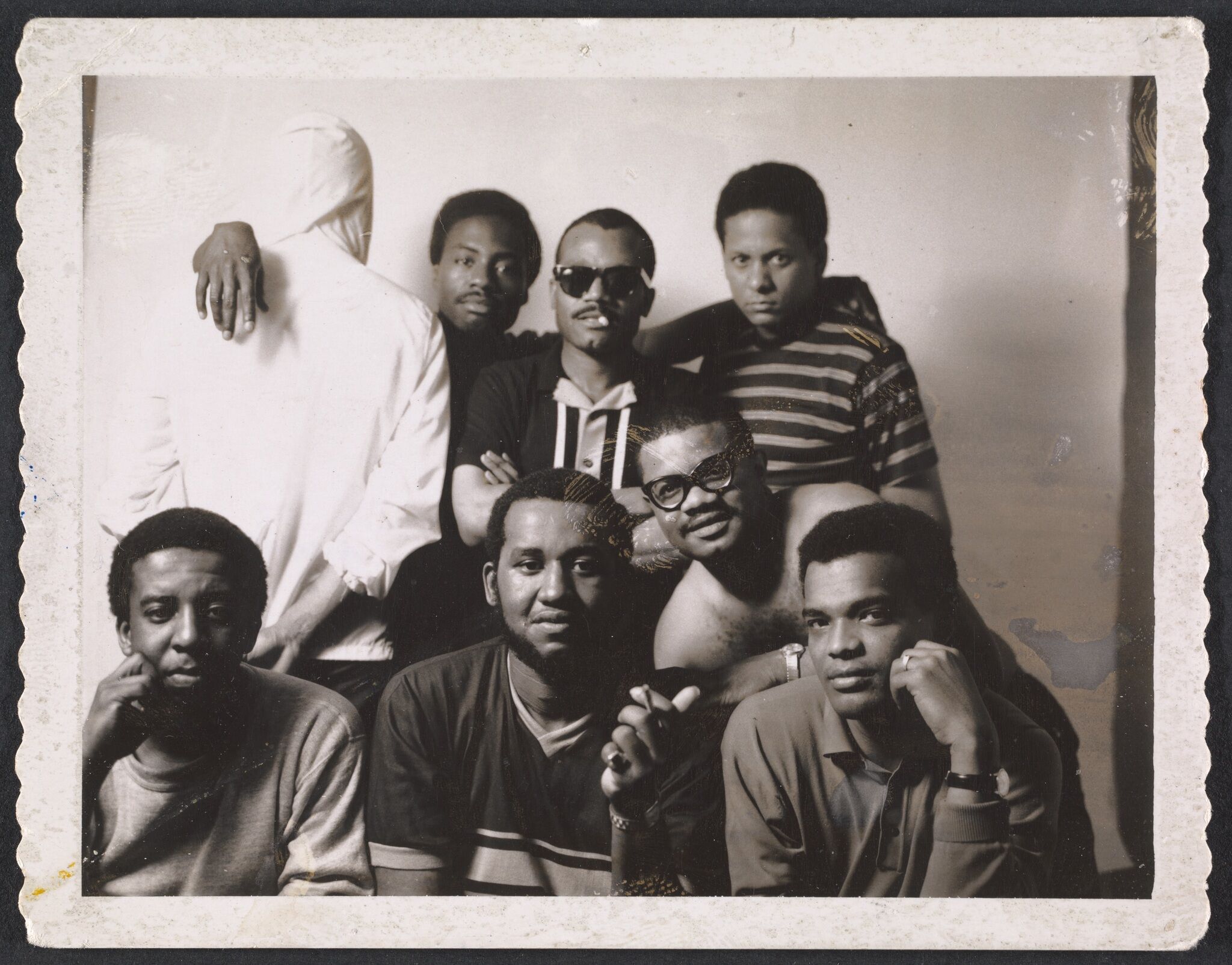 A group photograph of seven Black photographers.