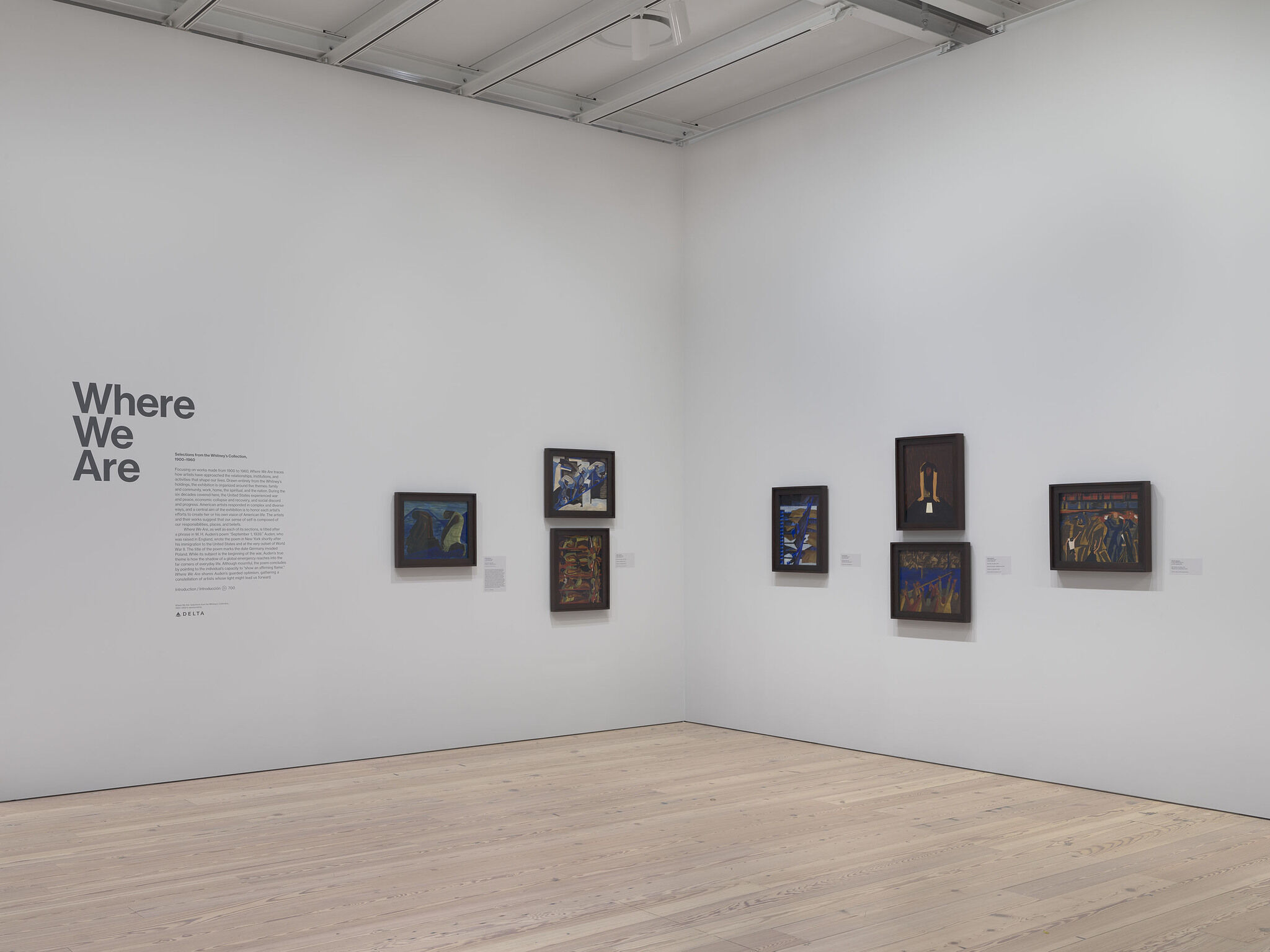 A gallery with wall text and art.