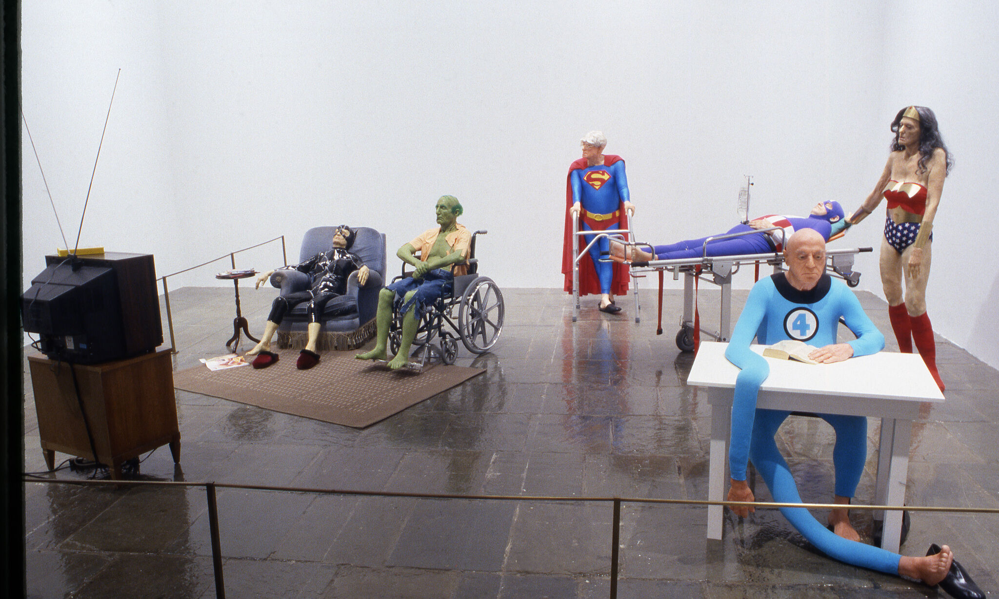 Sculptures of famous superheroes at old ages.