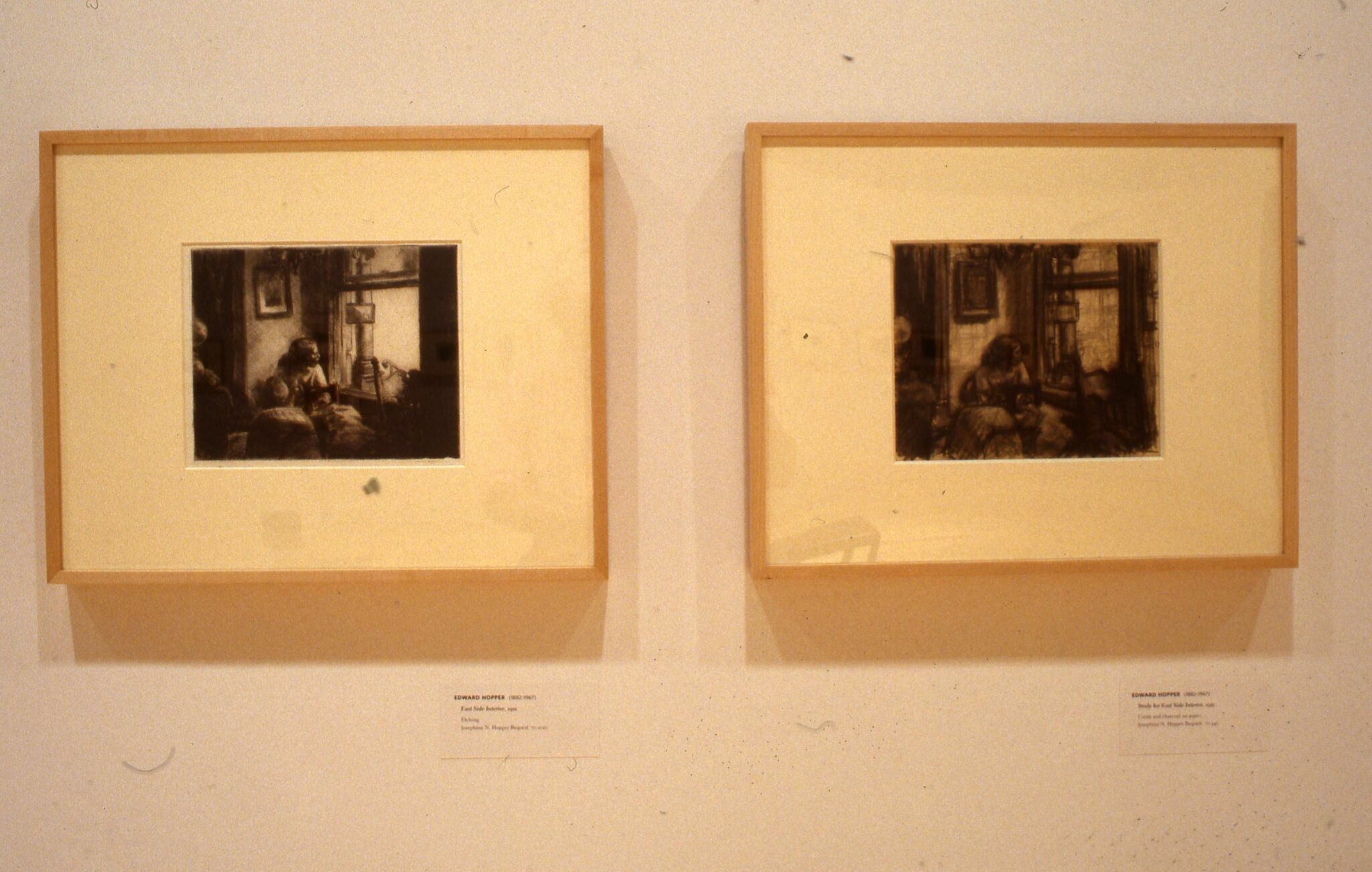 Two framed prints by Edward Hopper hung side by side on a white wall.