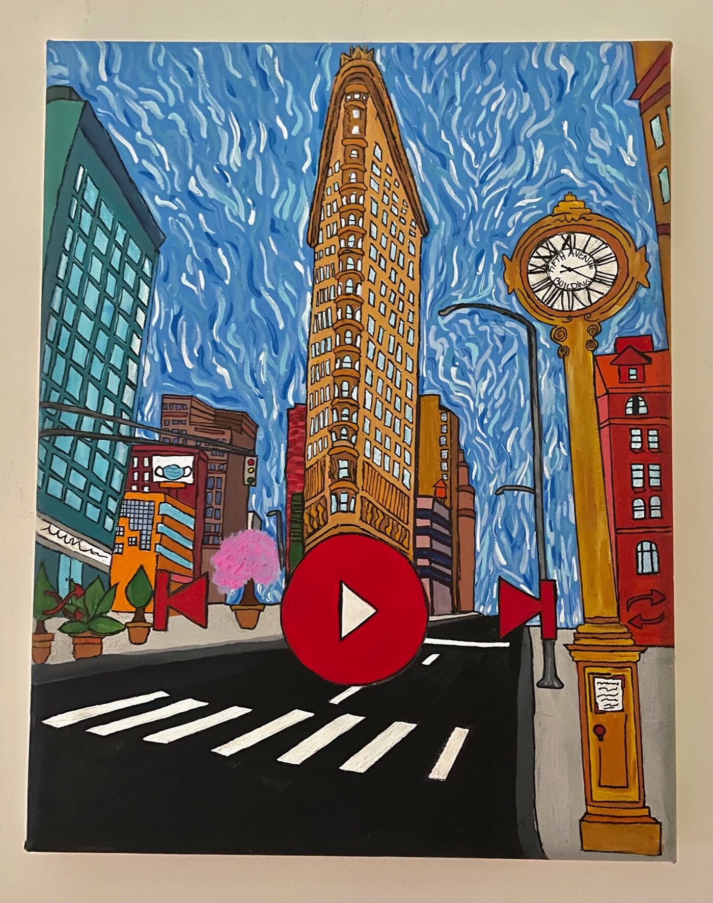 A drawing of the Flatiron Building with a red, circular play button drawn in the foreground.