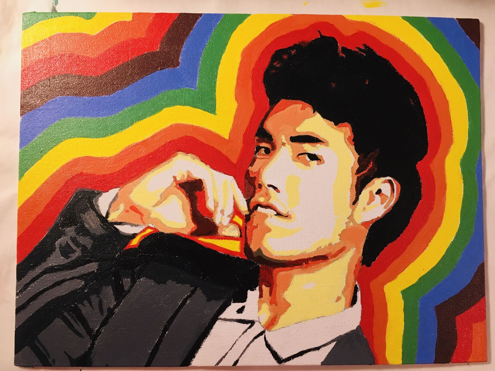 A portrait of Eugene Lee Yang encompassed by an alternating rainbow outline. 