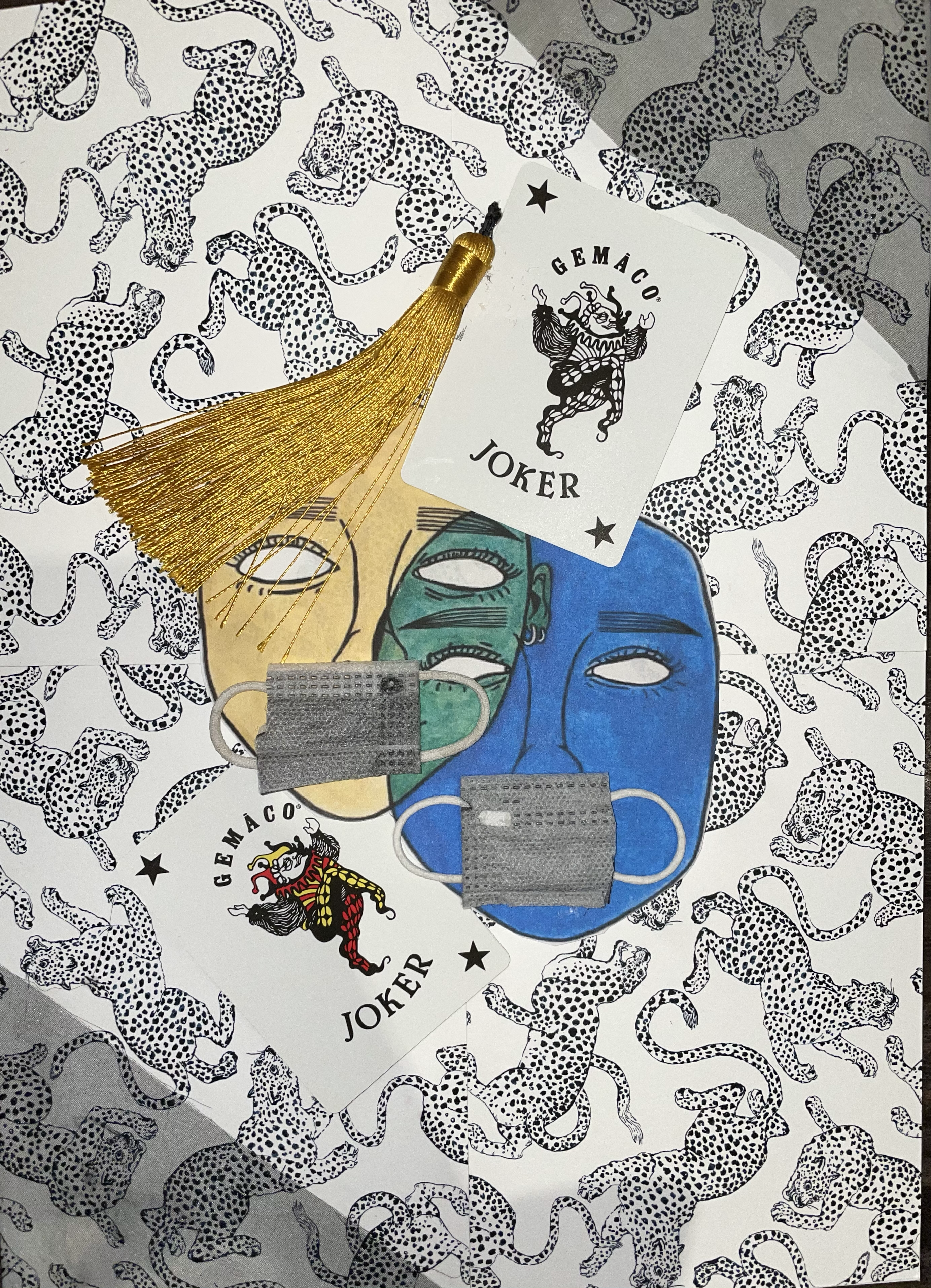 A drawing of two theatrical masks with pieces of cloth face masks layered over their mouths. 