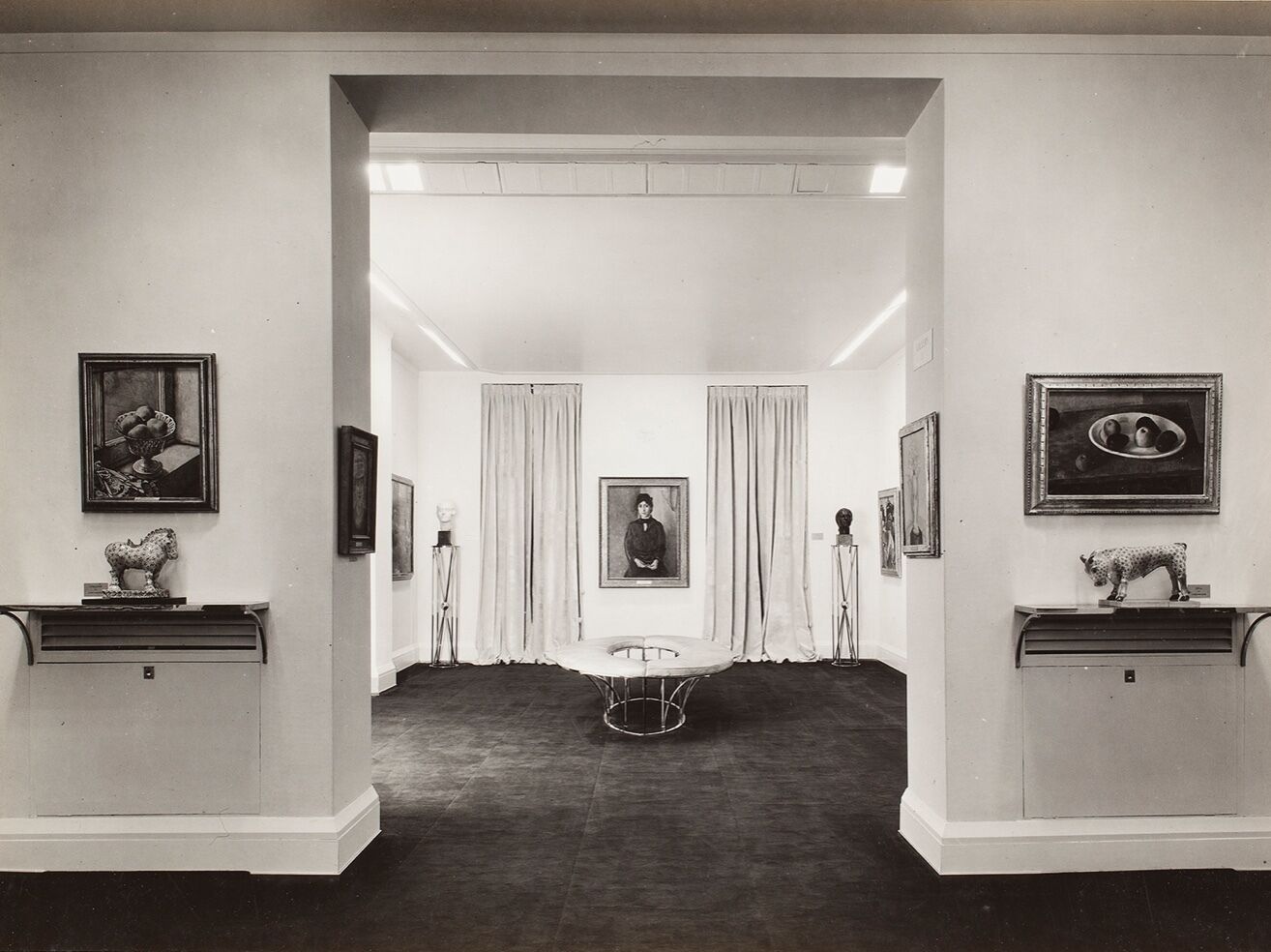 A center doorway leading into an exhibition room. 