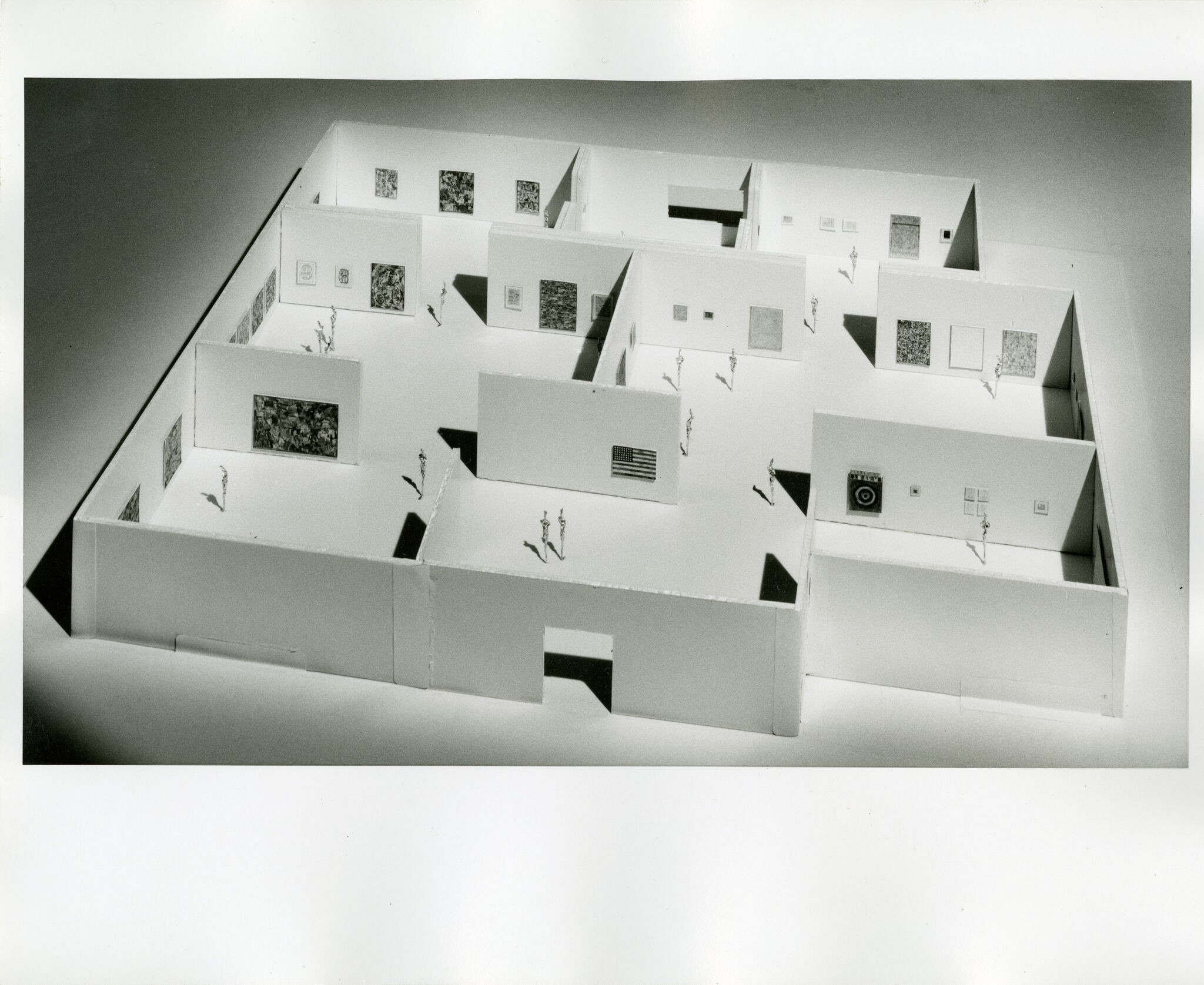 Black-and-white photograph of a three-dimensional model of a floor plan.