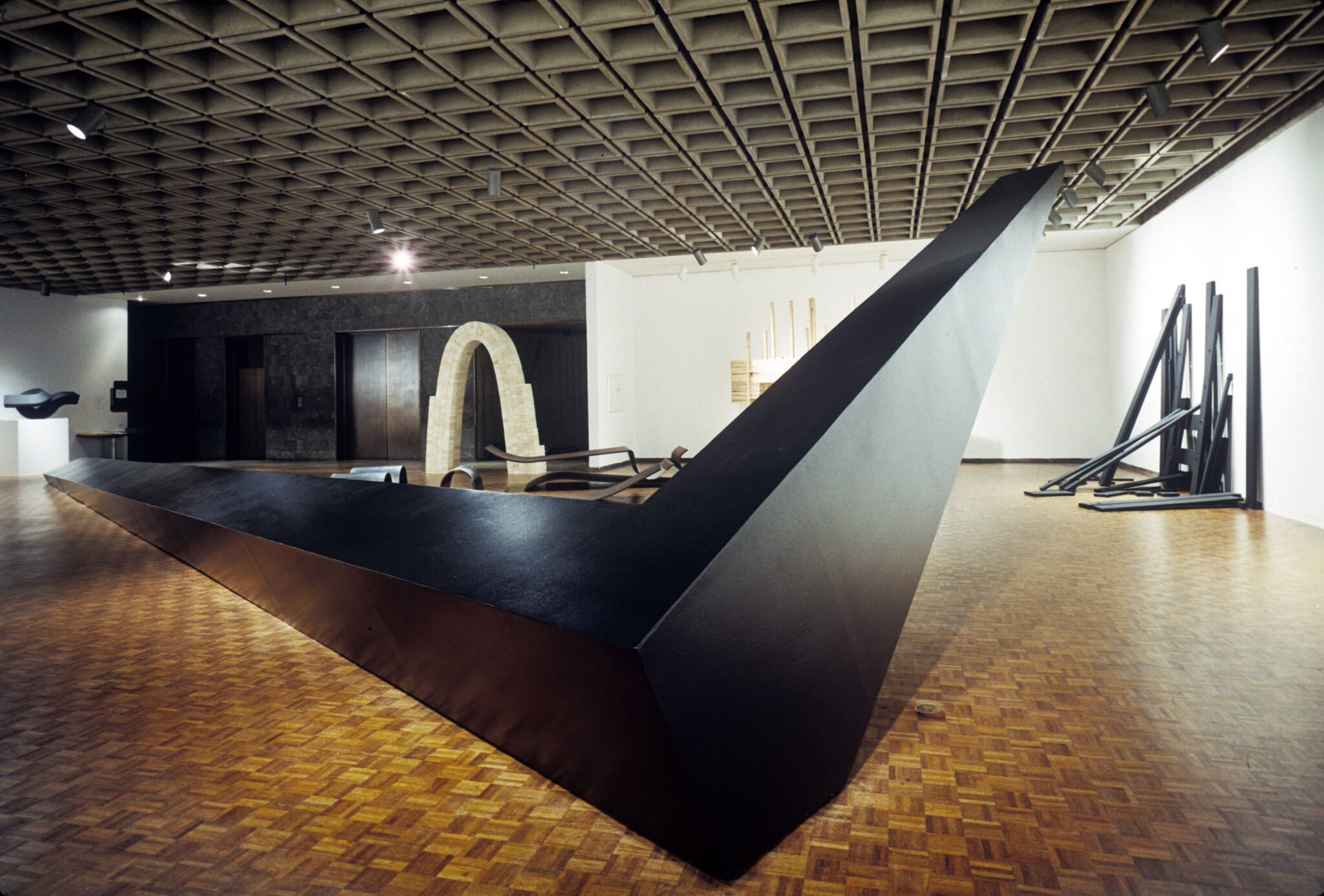 Large, angular metal sculpture in a gallery.