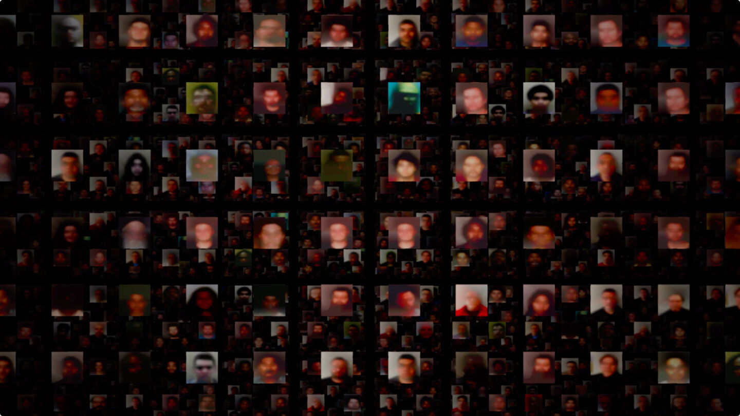 Blurred images of mugshots arranged in a grid against a black background.