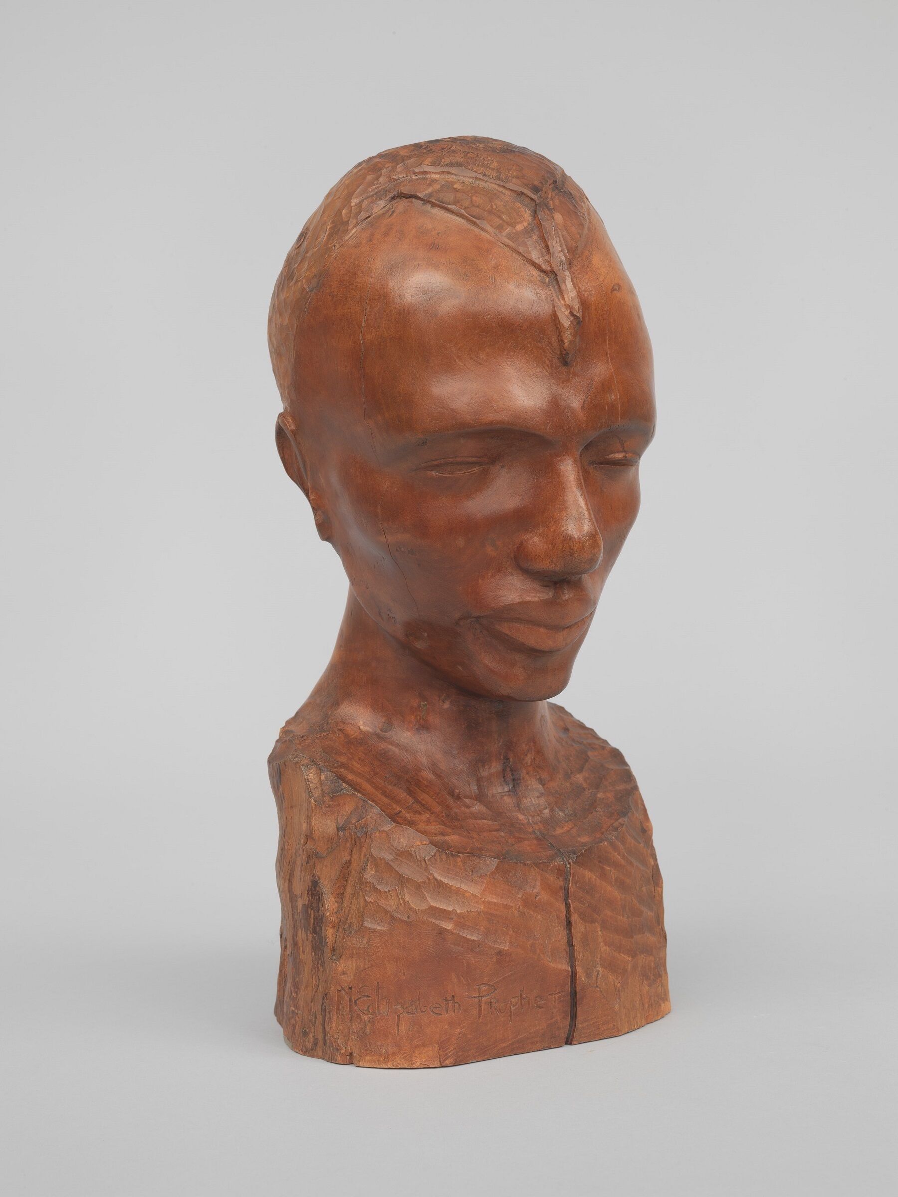 Sculpture of human head and neck.