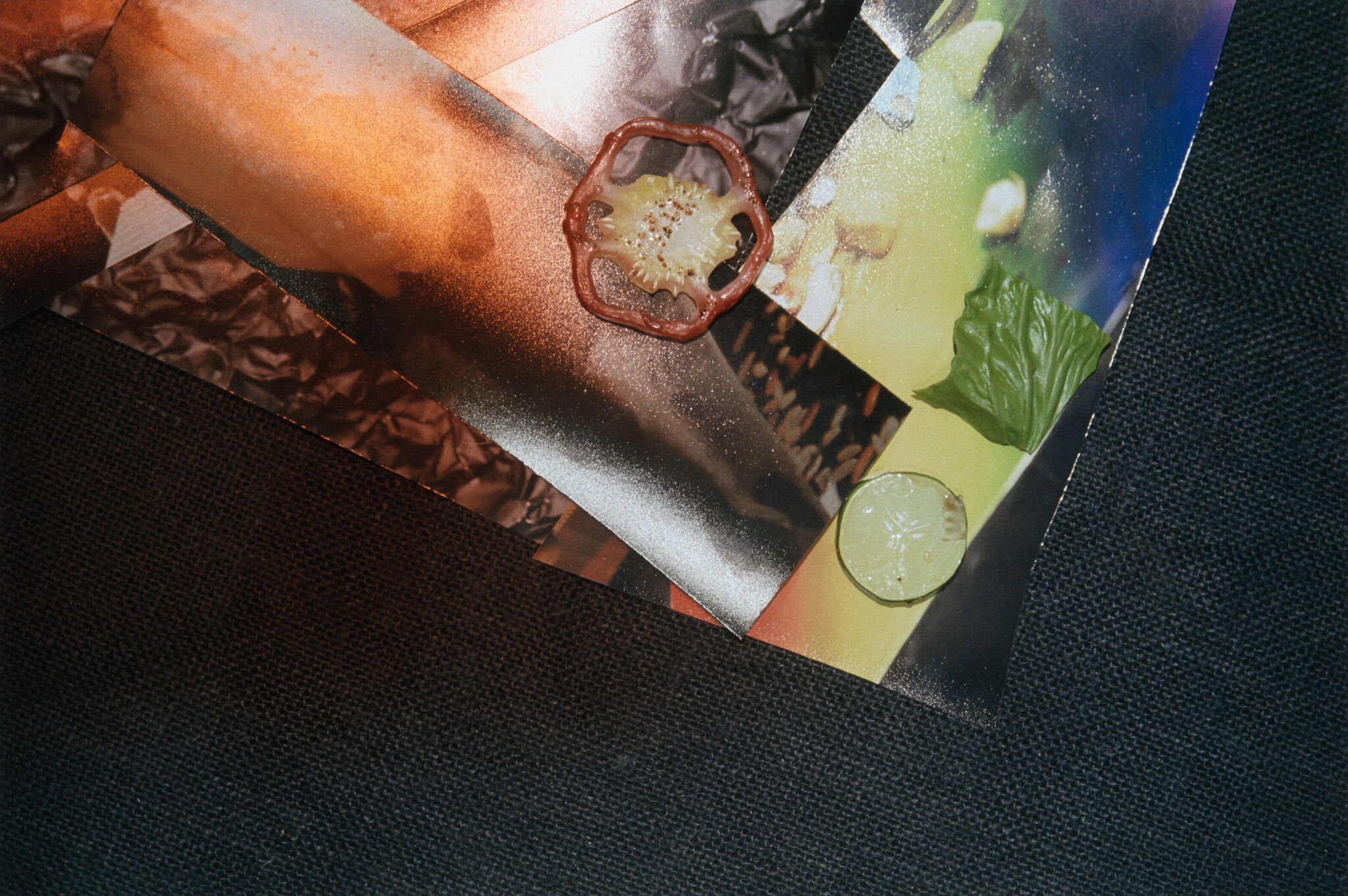 Bright colors and decomposing food on a dark textured background. 