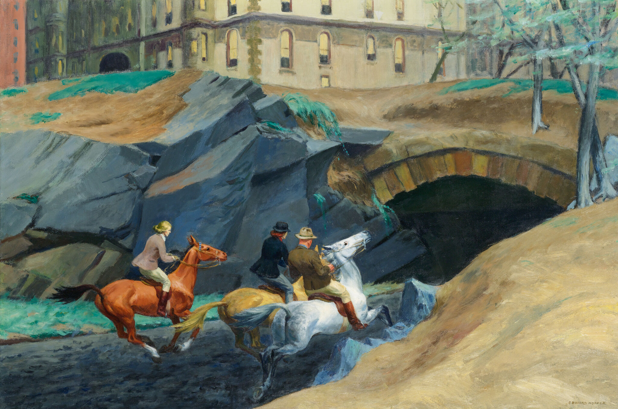 Two men on horseback ride through a tunnel surrounded by greenery. 