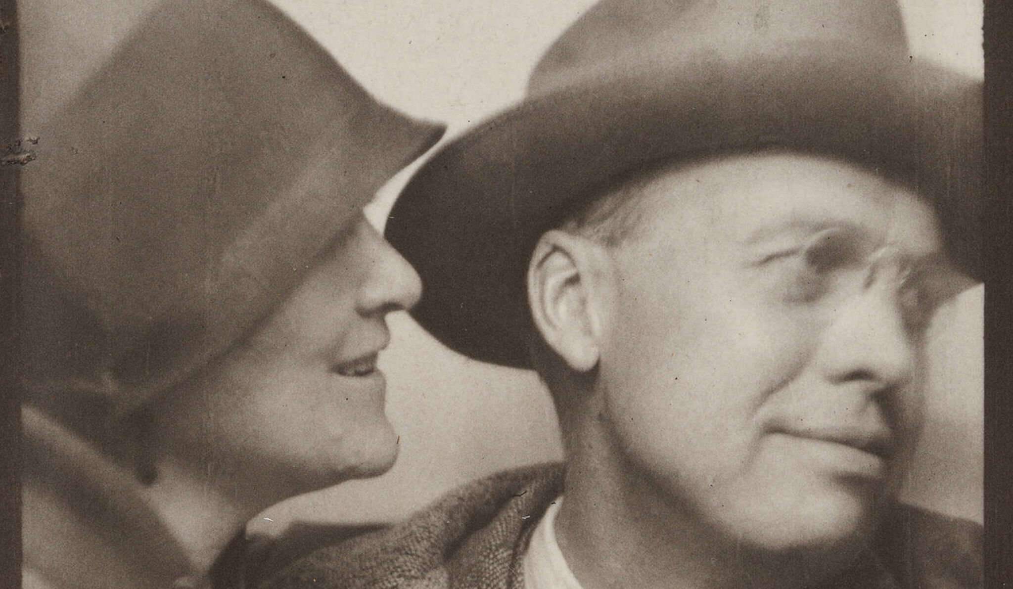 photo booth image of Edward and Josephine Hopper wearing hats. 