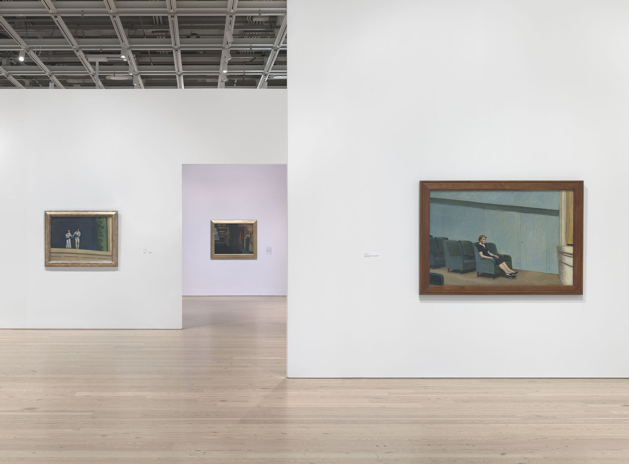 Gallery walls with artwork hung up. 