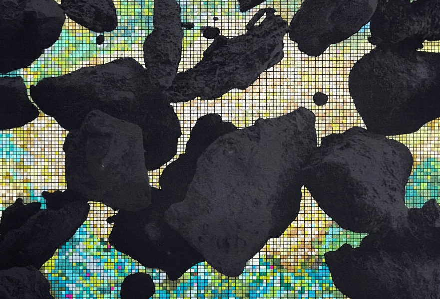 Black and gray rocks float in space with a pixelated blue and yellow graphic in the background.
