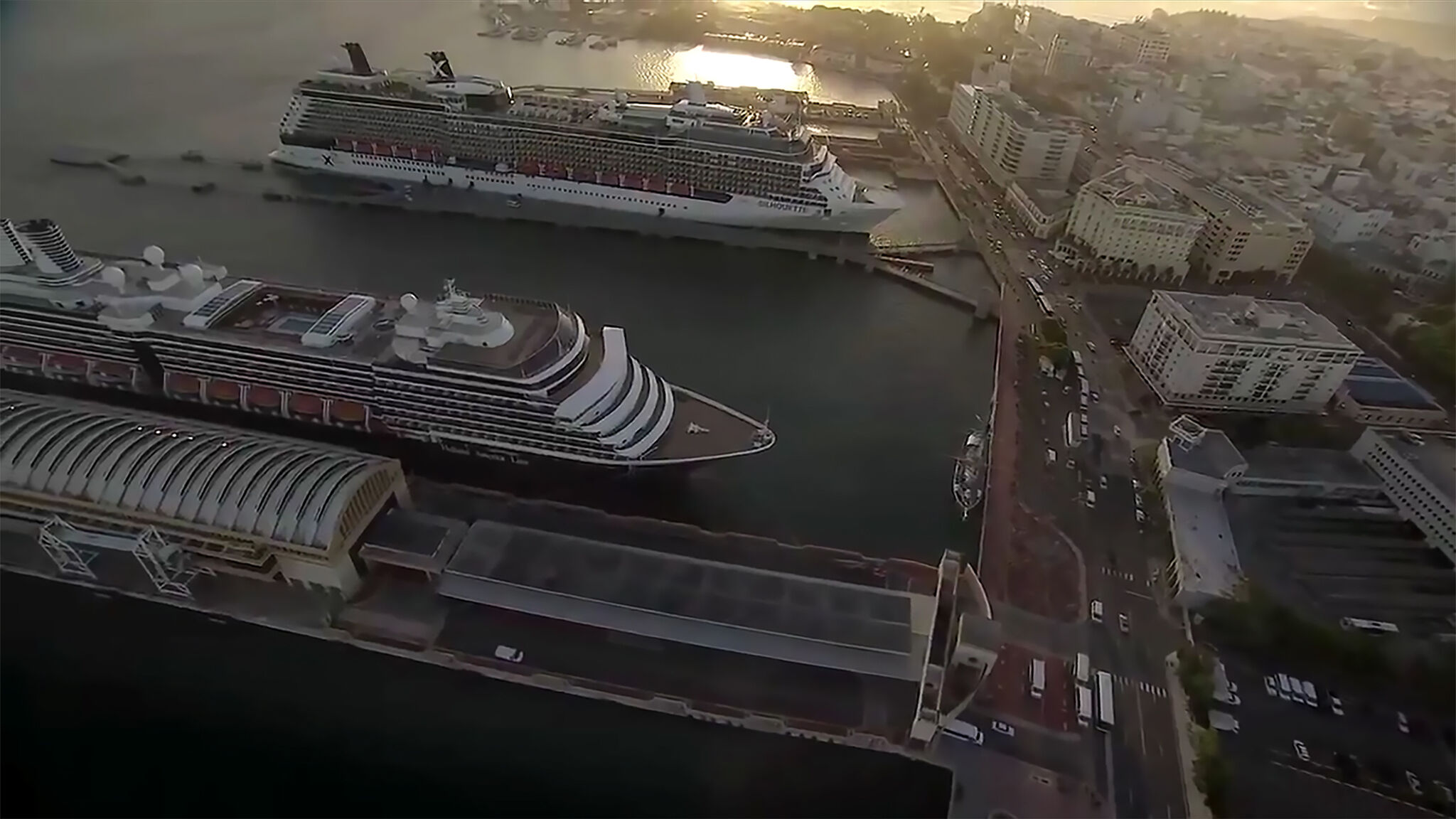 large cruise ships in a harbor. 