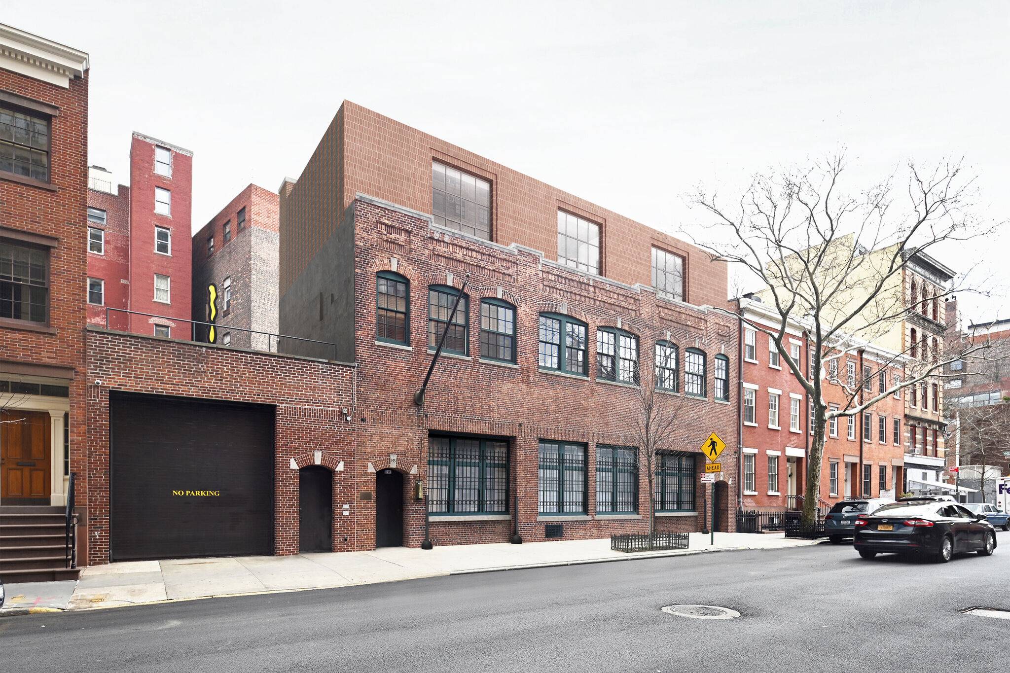 A city street with a brick building.