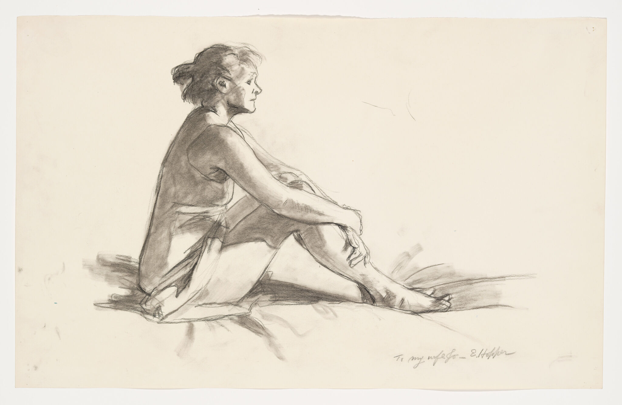 Graphite study of a side sitting on the ground and holding her knees.