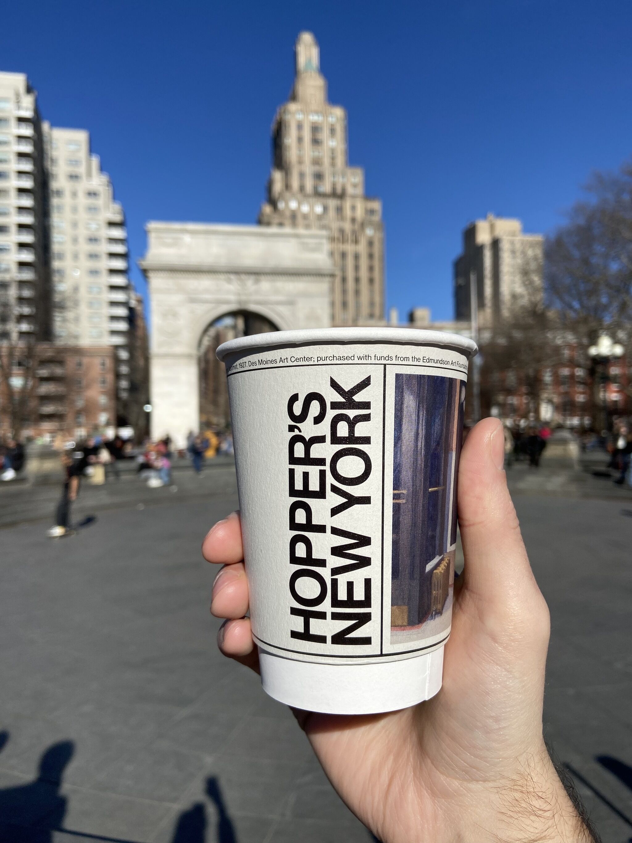 A photo of a custom Edward Hopper's New York designed to-go cup featuring Hopper's painting, Automat.