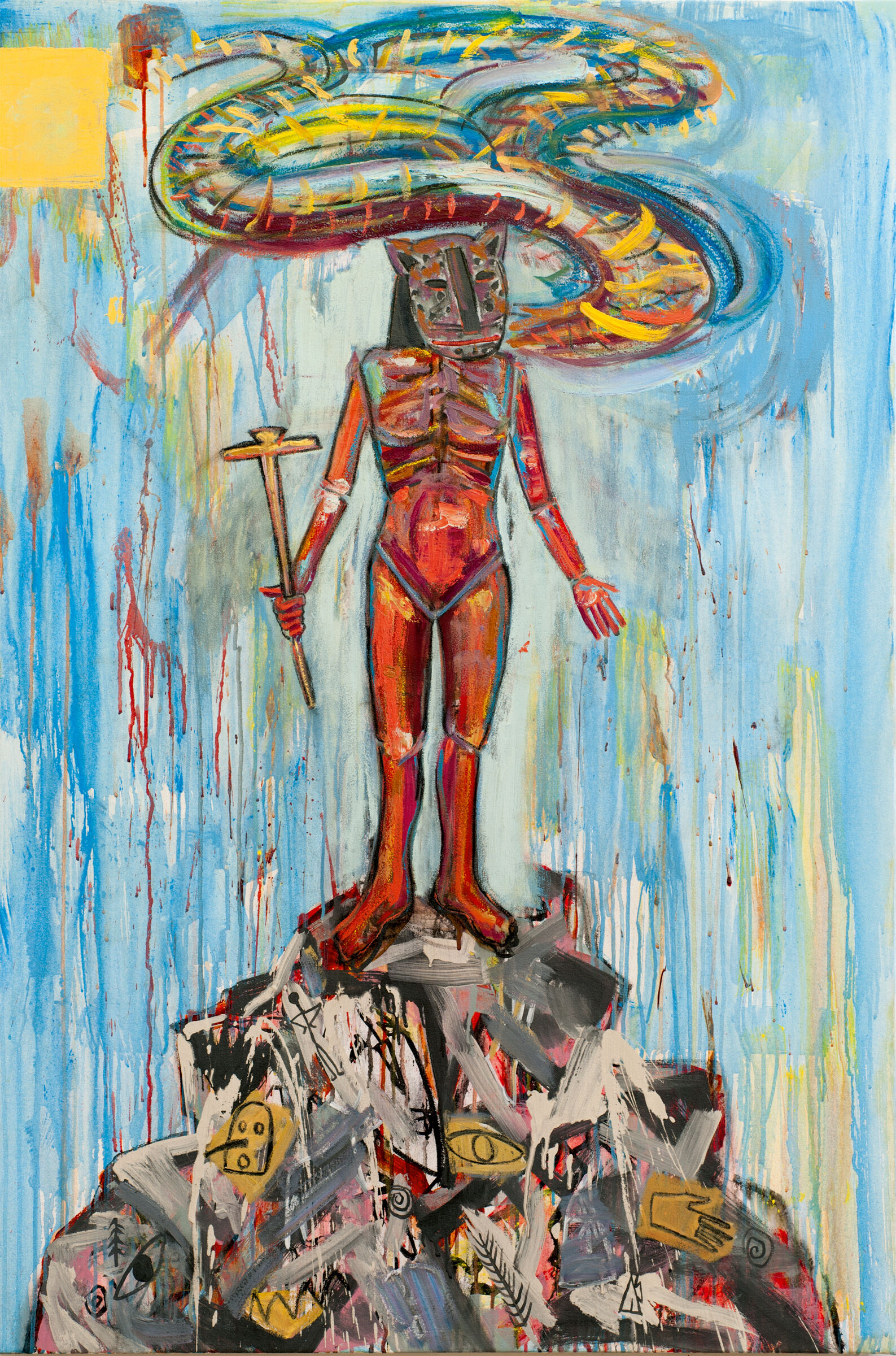 A person with a feline head stands a top a pile of materials with a twisting shape of color swirling around their head.
