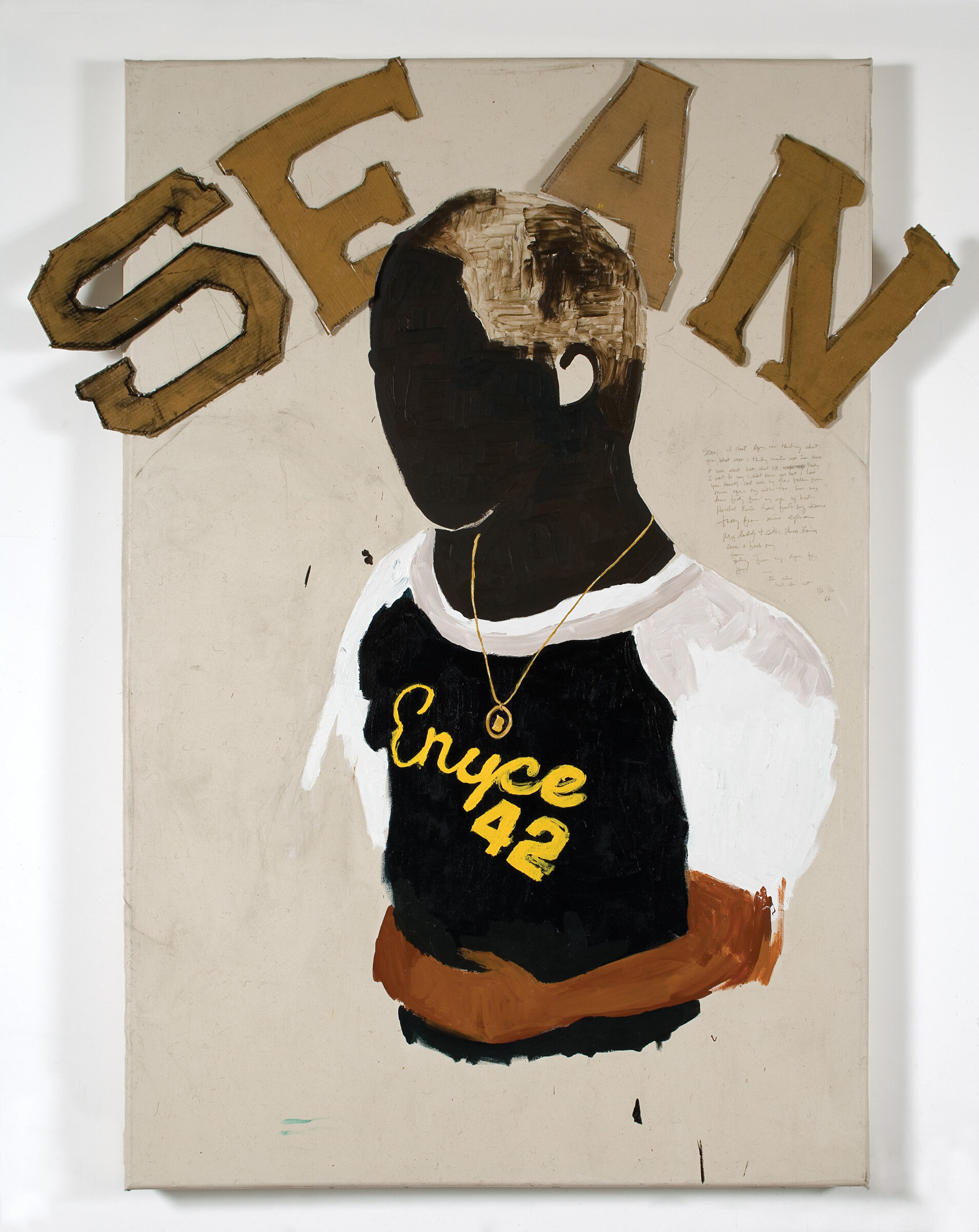The shape of a person wearing a t-shirt with the words "SEAN" in gold letters above. 