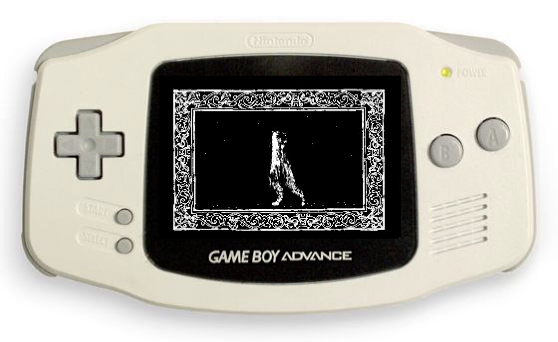 A beige colored gameboy advance on a white background. On a black screen is a white ornate frame surrounding what appears to be a shadowy distorted figure.
