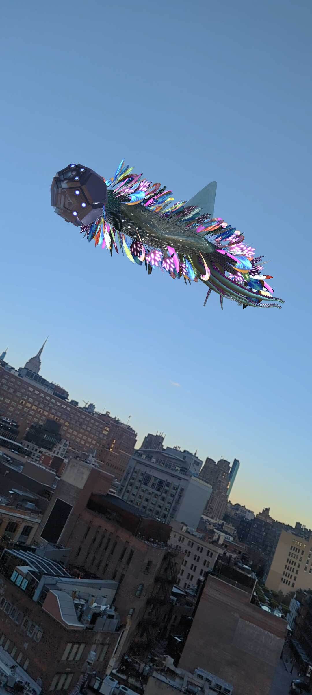 A large creature floats over the skyline with many feathers fluttering around its body. 