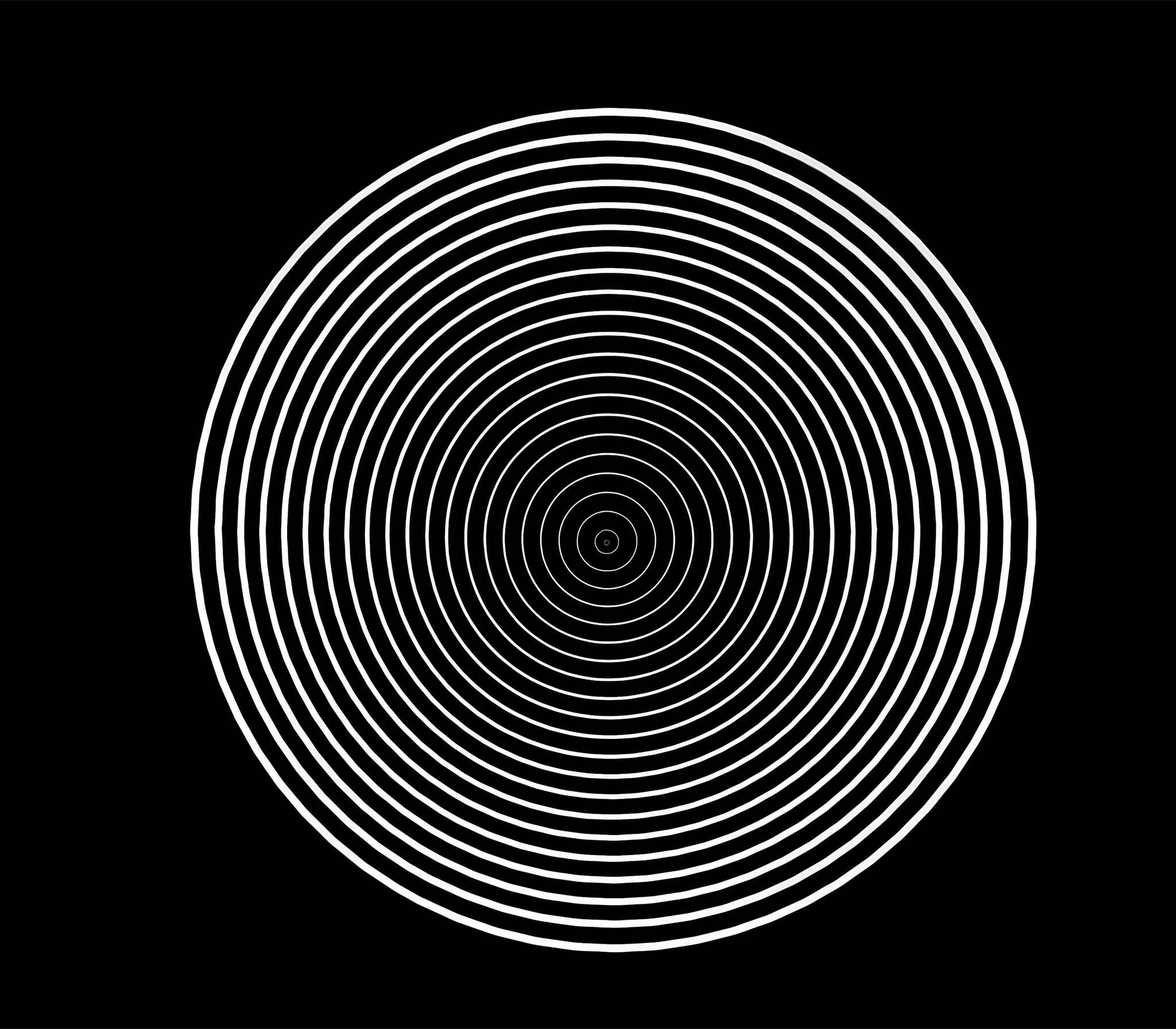 Concentric white circles creating an optical illusion on a black background.