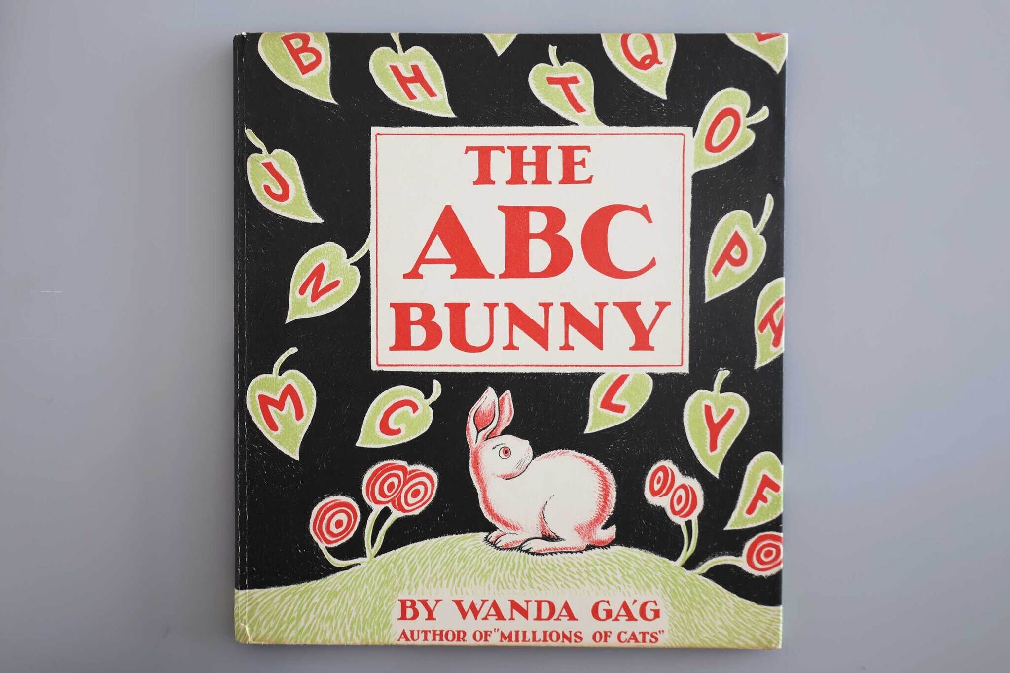 Cover of "The ABC Bunny" book by Wanda Gág with illustrations of a bunny, apples, and letters.