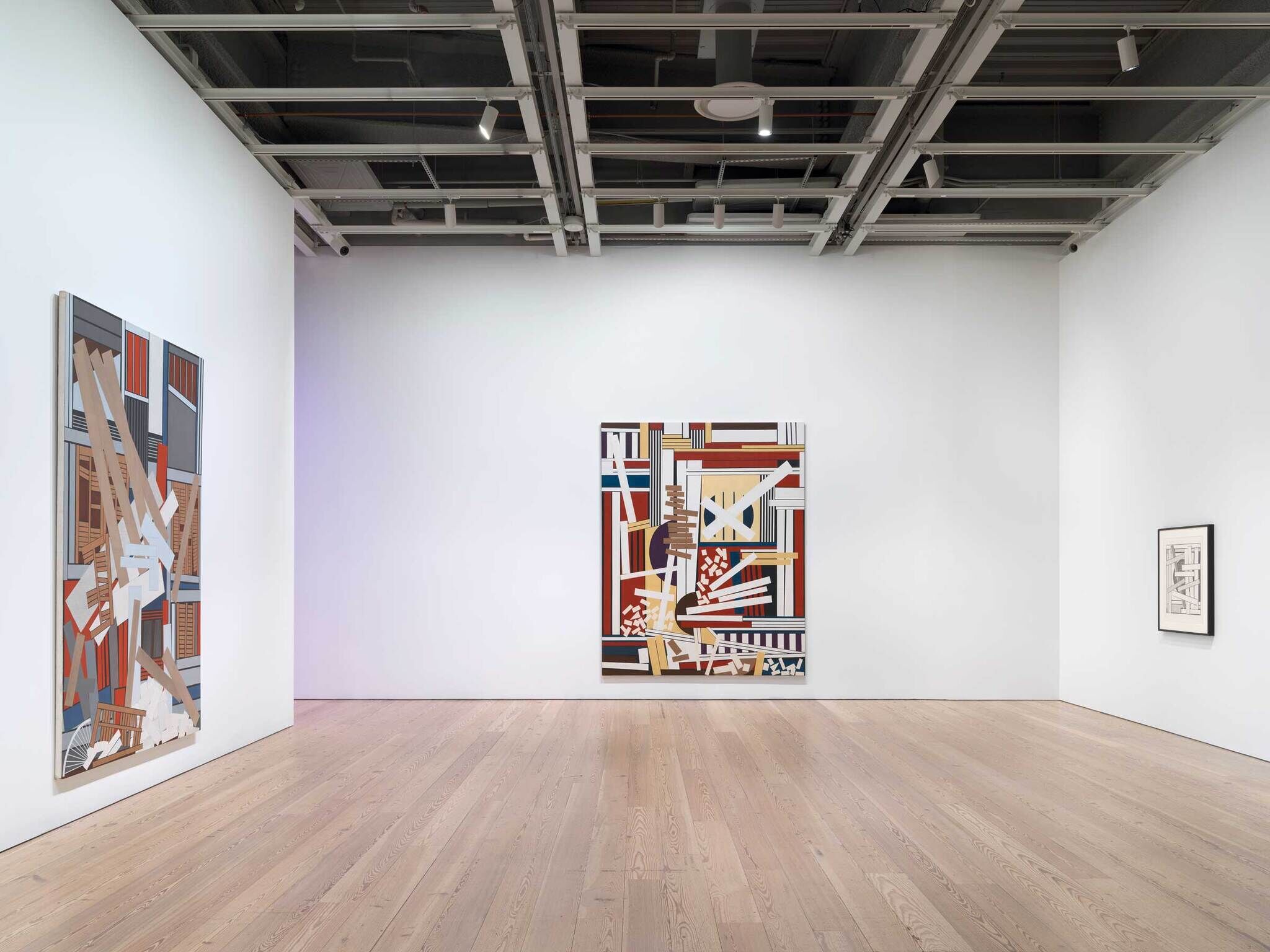 Modern art gallery interior with two large abstract paintings on white walls and a framed sketch on the right.