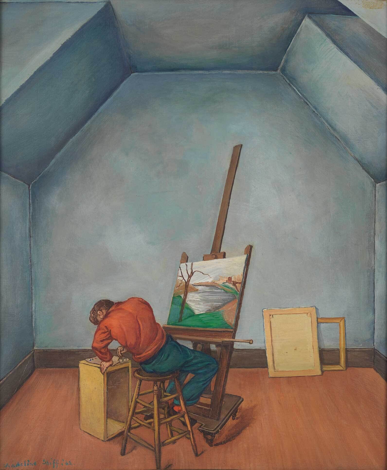 A man in a red shirt and blue pants leans over a stool in a blue-walled room, painting a landscape on an easel.