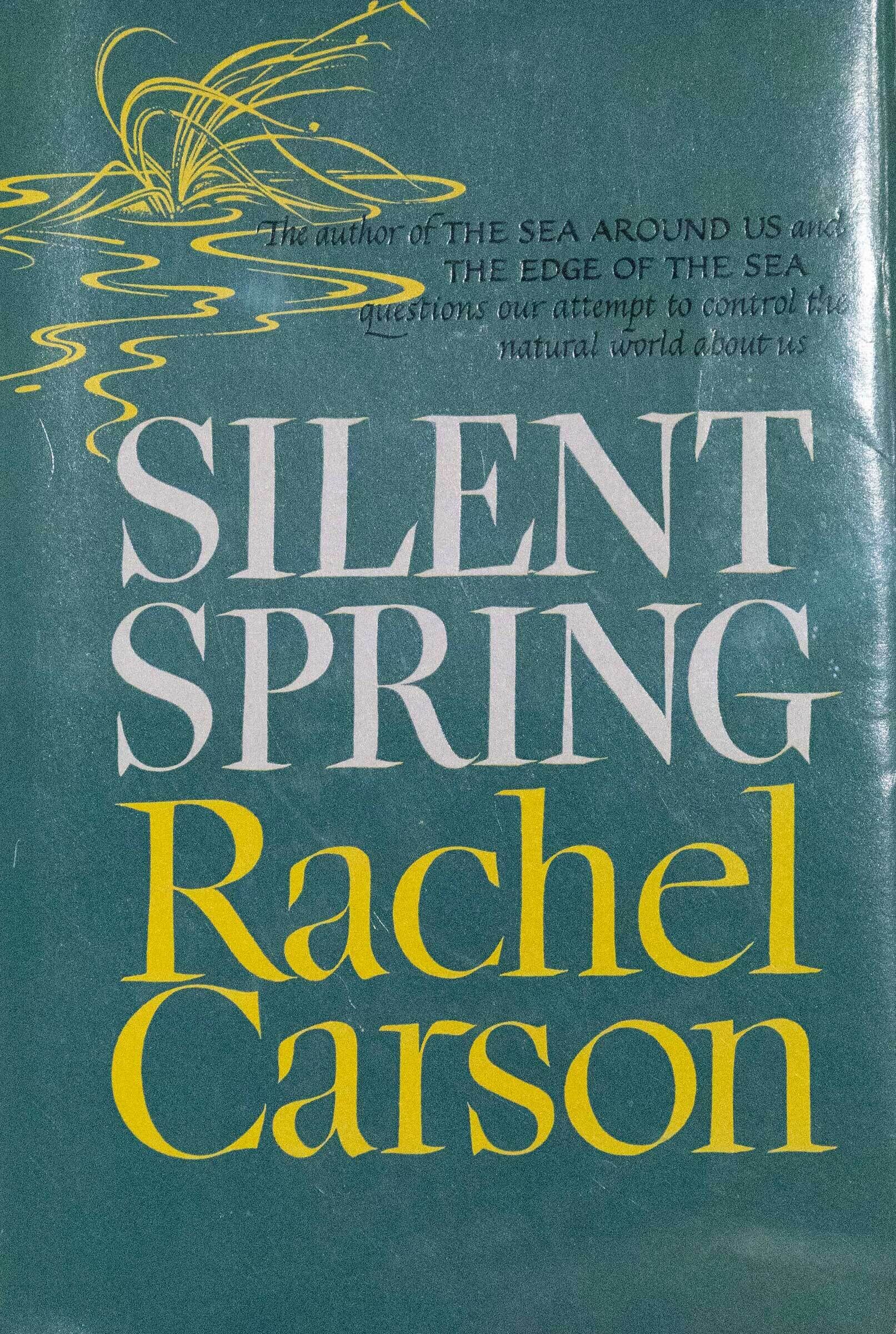Cover of "Silent Spring" by Rachel Carson, featuring a green background with yellow and white text and an abstract yellow design.