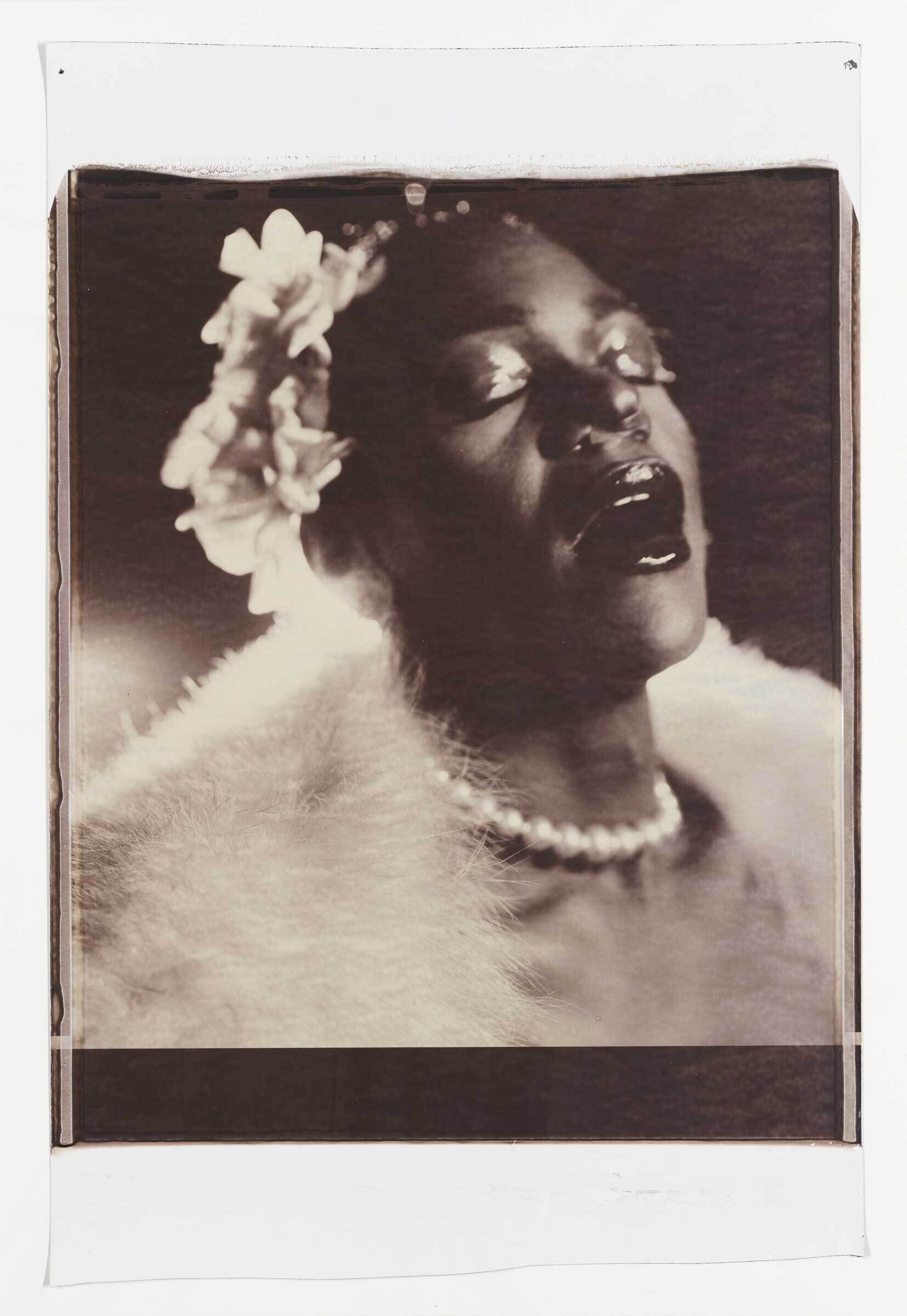 Sepia-toned portrait of Billie Holiday with closed eyes, wearing a floral headpiece, pearl necklace, and fur stole, exuding a vintage, glamorous vibe.