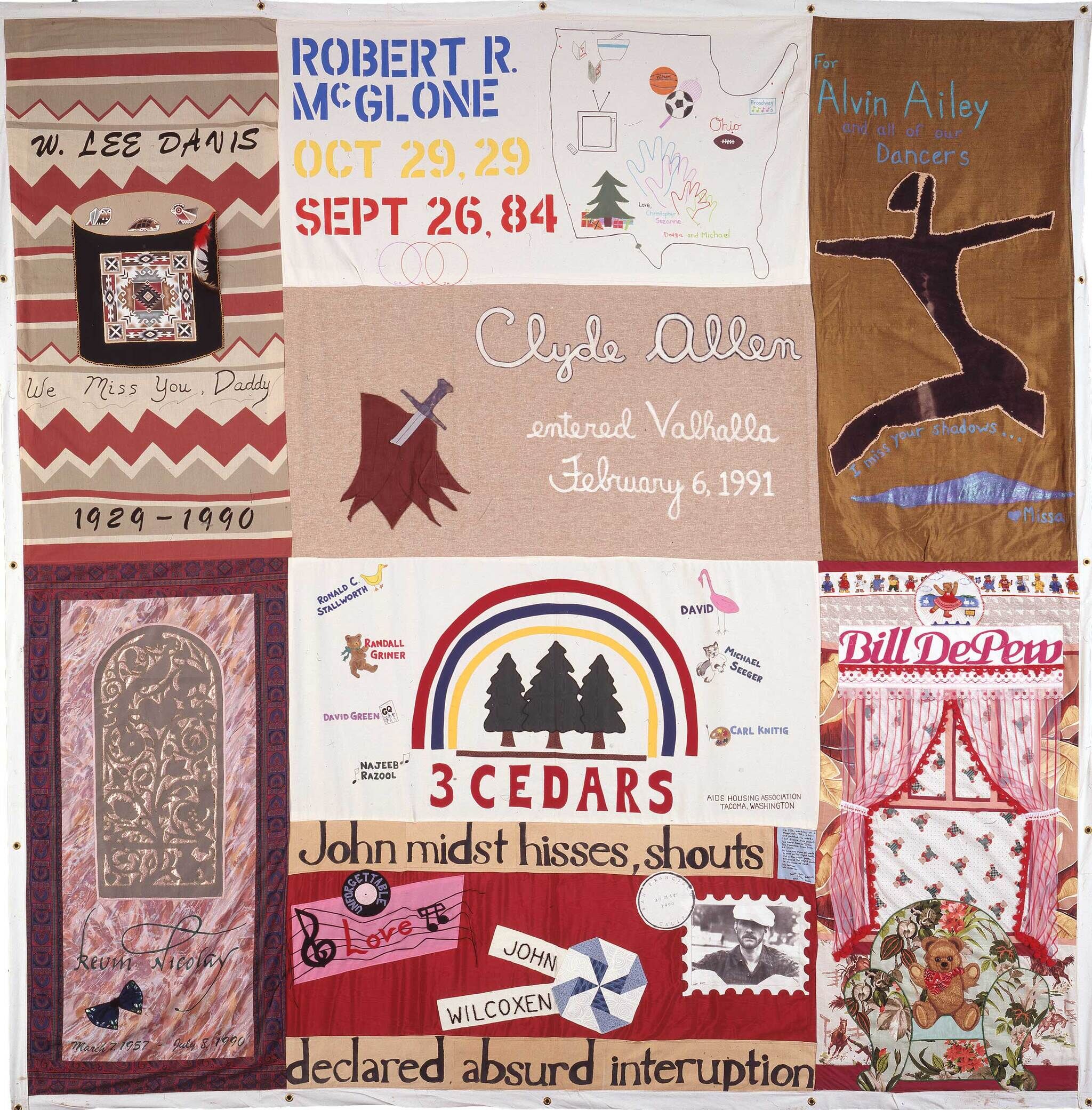 A quilt with various panels commemorating individuals, featuring names, dates, and personal messages, including "Robert R. McGlone" and "Bill DePew."