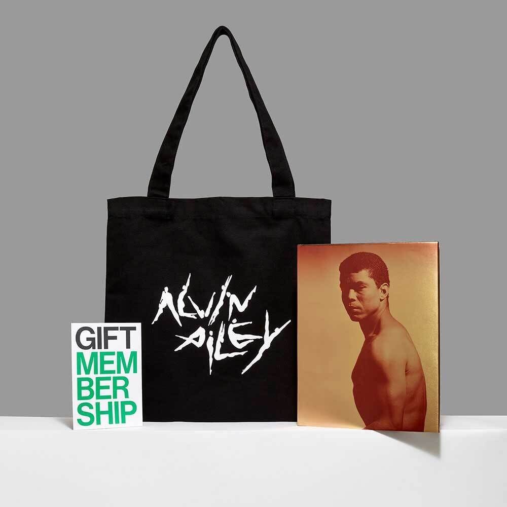 Black tote bag with "Alvin Ailey" text, a gift membership card, and a sepia-toned portrait of a shirtless man.