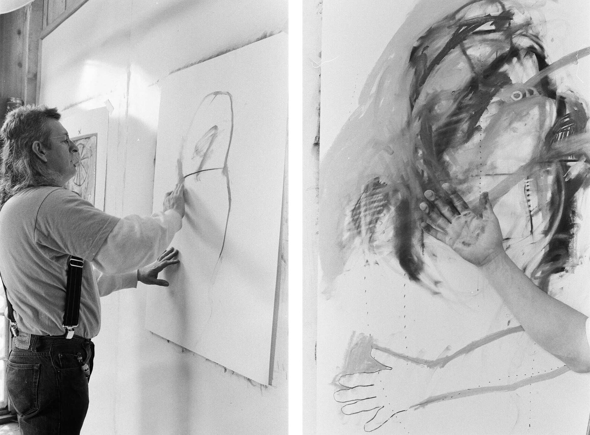 Artist painting on a large canvas, using hands to create abstract strokes. Black and white photo, showing creative process.